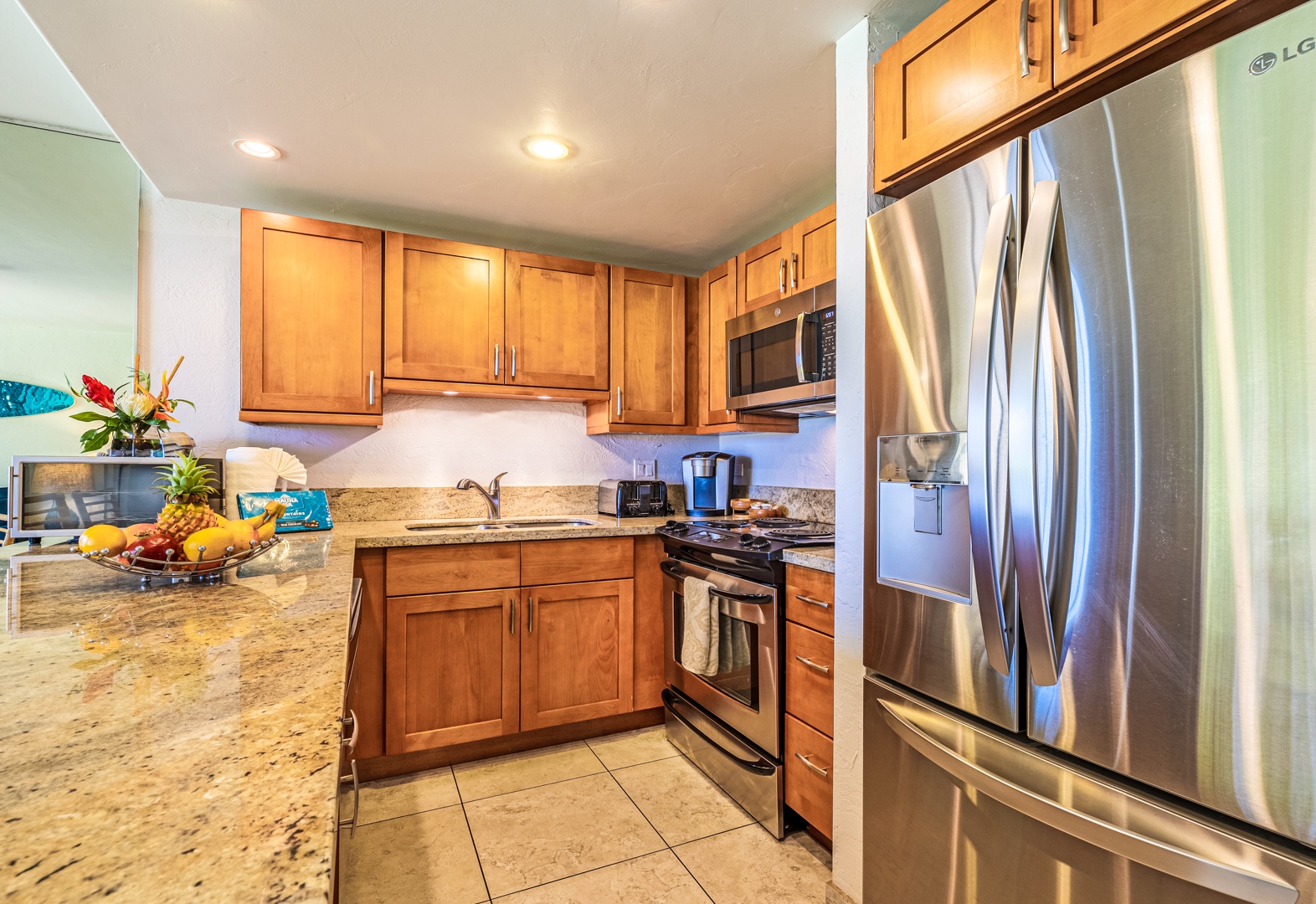 Lahaina Vacation Rentals, Papakea K-105 - The fully equipped kitchen features stainless steel appliances and granite countertops, providing everything you need