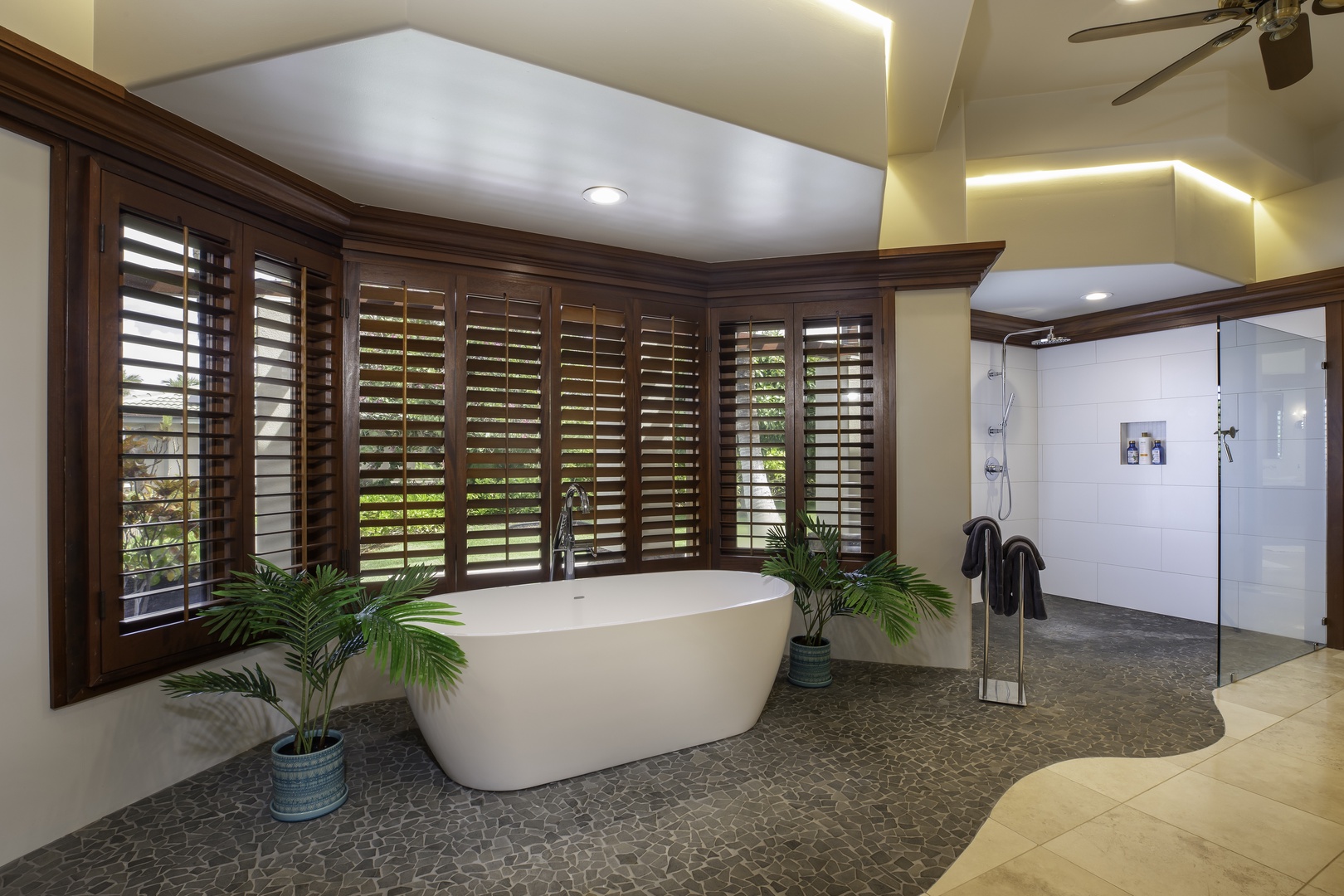 Kamuela Vacation Rentals, Champion Ridge 7 - Soak away your stress in this luxurious bathroom featuring a stunning freestanding tub, elegant shutters, and a spacious glass shower.