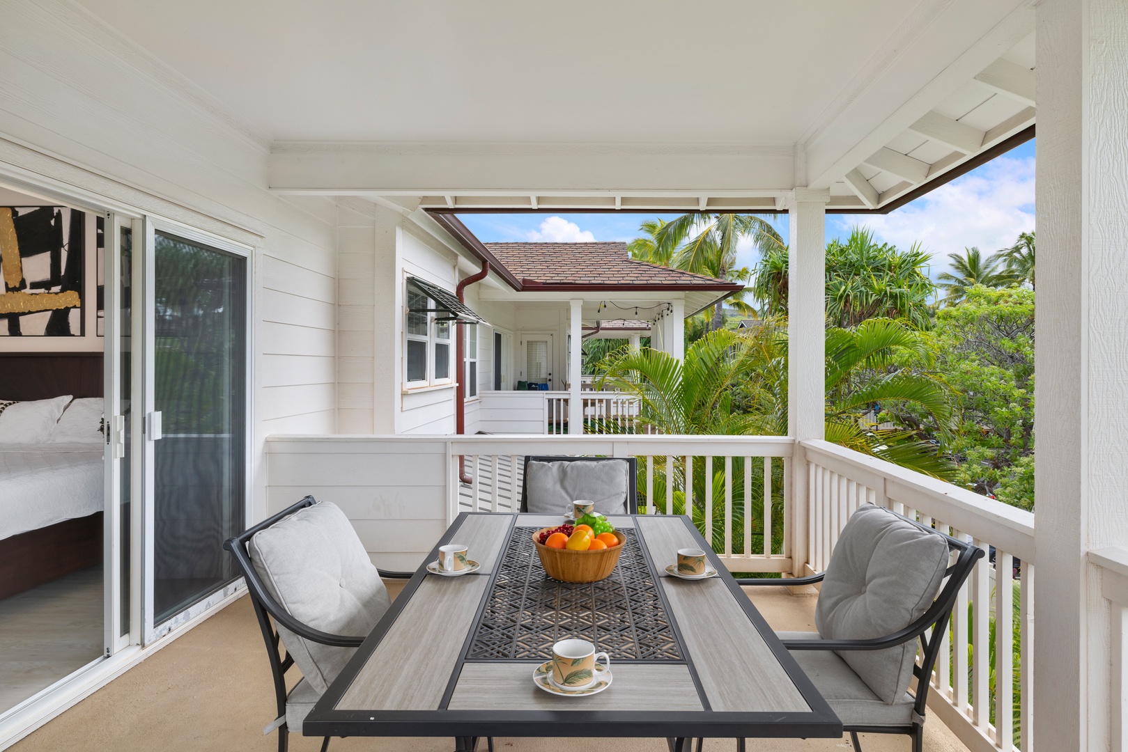 Kapolei Vacation Rentals, Coconut Plantation 1078-3 - Enjoy meals in a tropical setting in the inviting outdoor patio with a dining set.