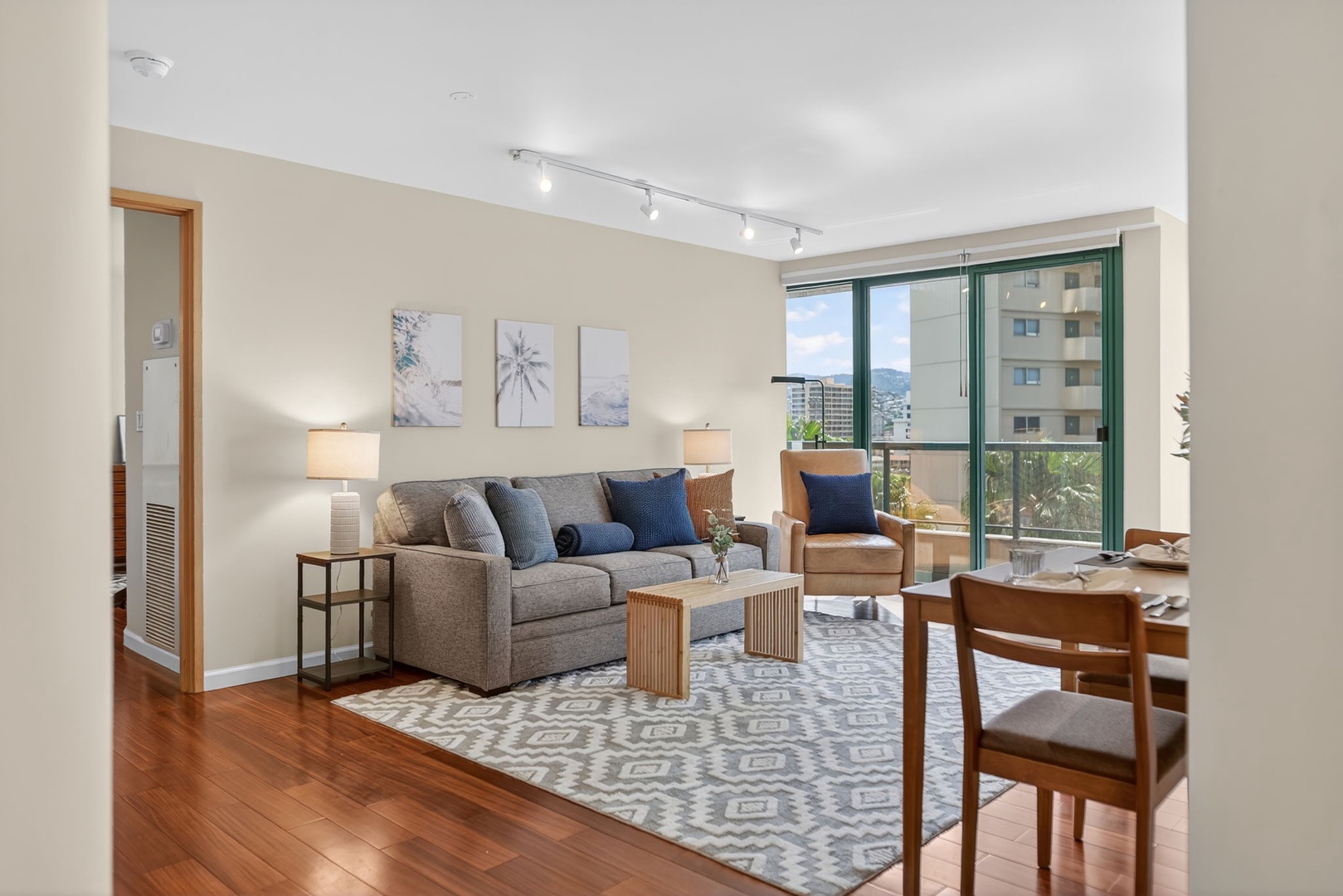 Honolulu Vacation Rentals, Island View at Waikiki Landmark - Stretch out in this bright living area with city views and warm hardwood flooring.