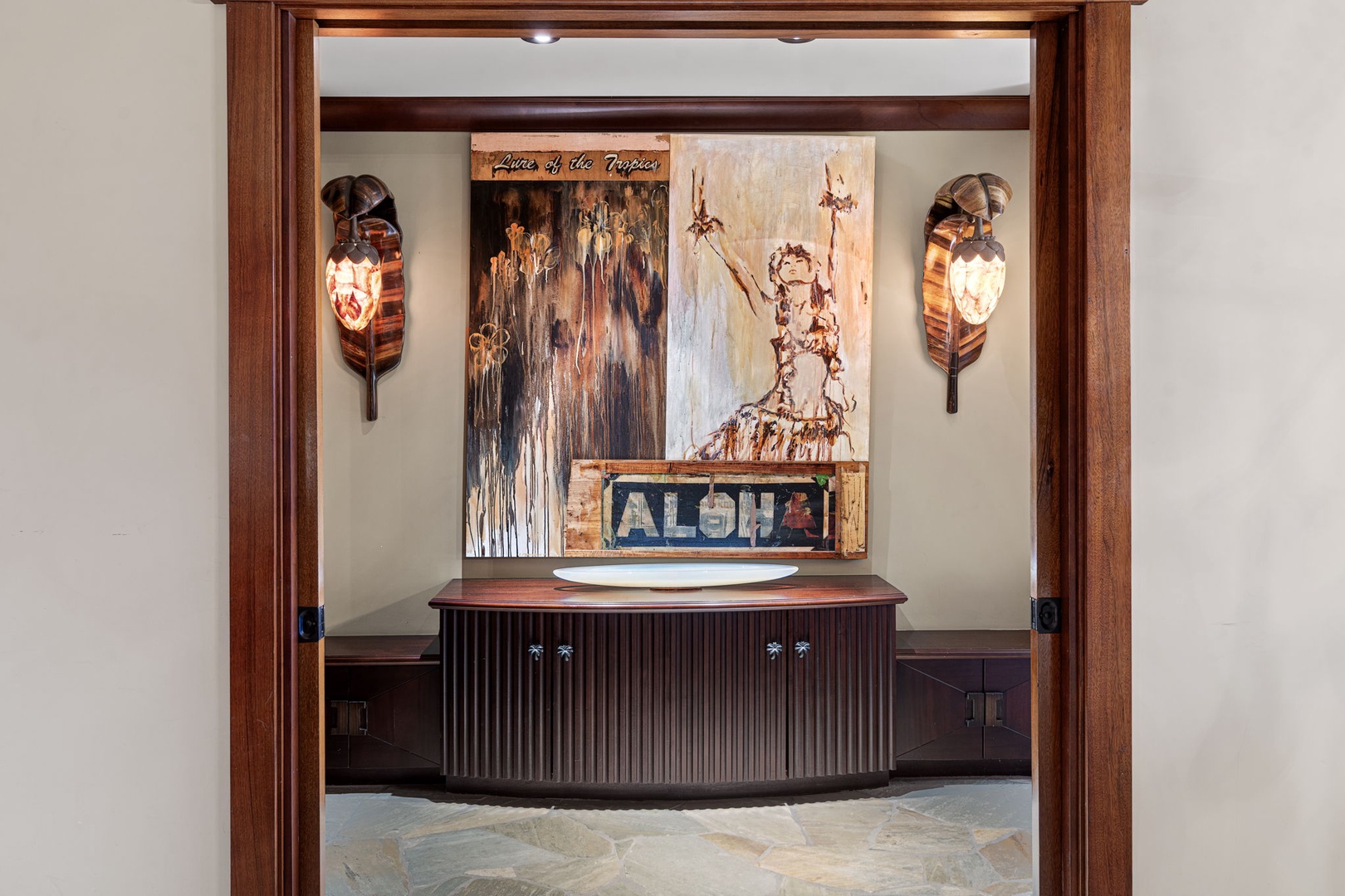 Kamuela Vacation Rentals, Hale Konane - A beautifully designed entry to the primary suite, accented with Hawaiian artwork and custom wood finishes.