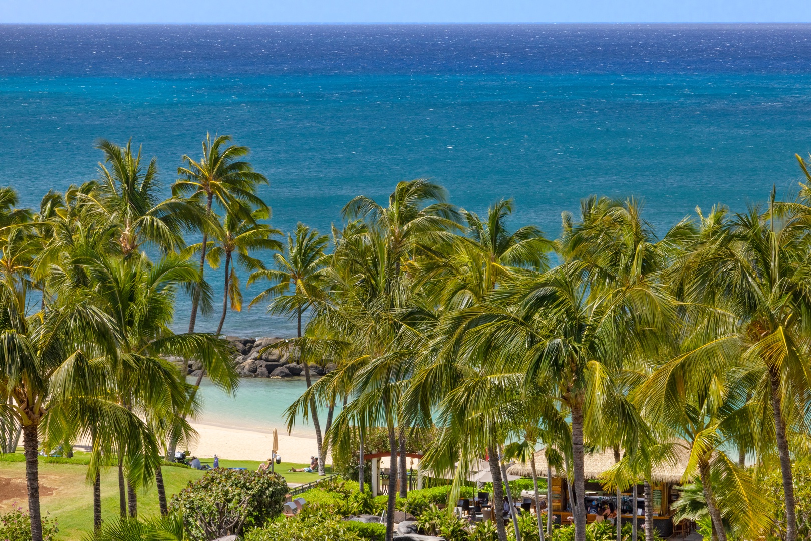 Kapolei Vacation Rentals, Ko Olina Beach Villas O805 - The lagoon is the perfect spot to relax under the trees and enjoy the beach.