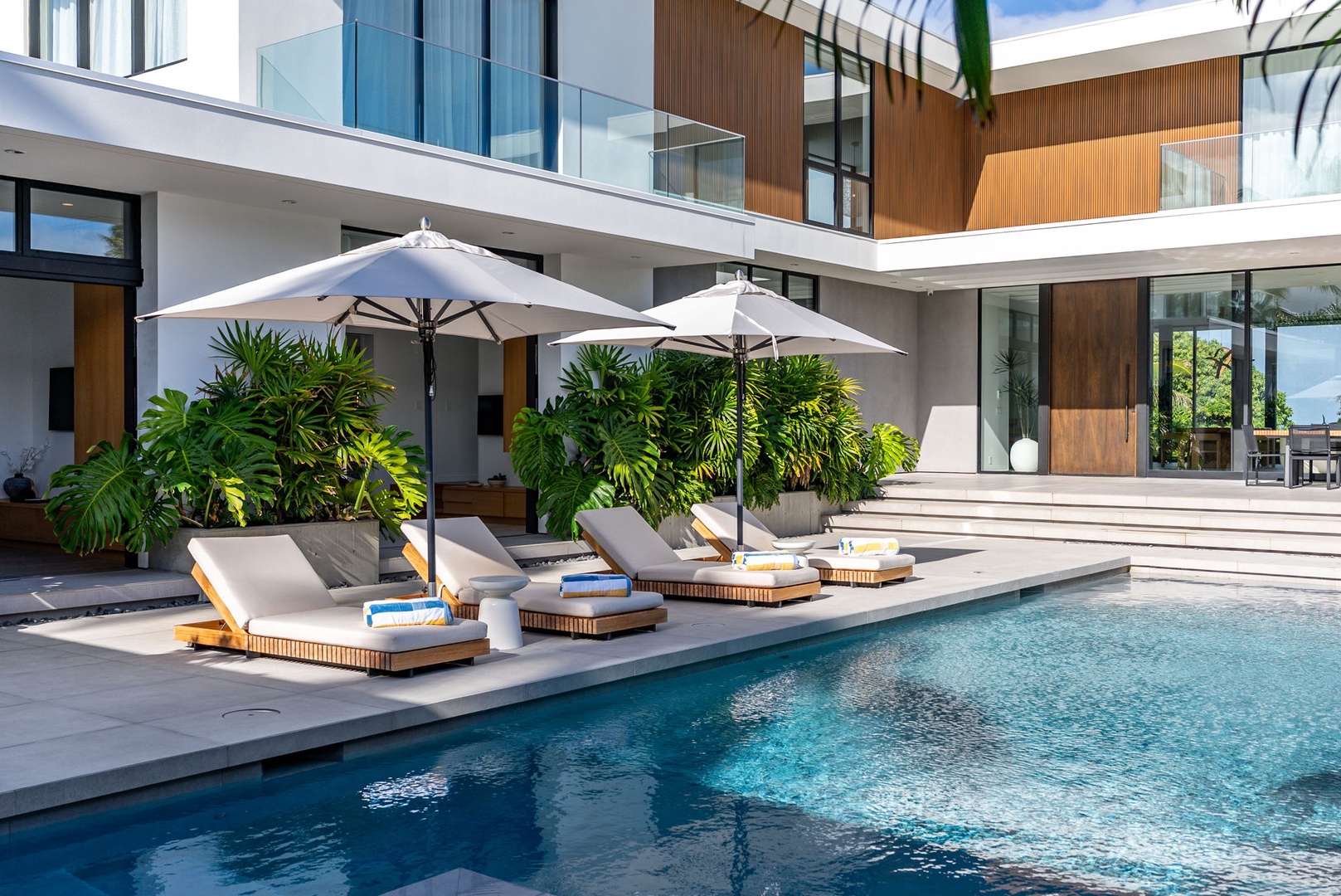 Kailua Vacation Rentals, Kailua Beach Escape - Stretch out on a lounger and settle into the home's relaxed indoor-outdoor lifestyle.