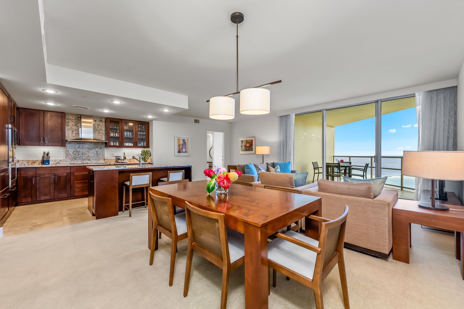 Honolulu Vacation Rentals, Kala'i 3203 - Open kitchen and dining area, perfect for cooking and entertaining with ocean views.