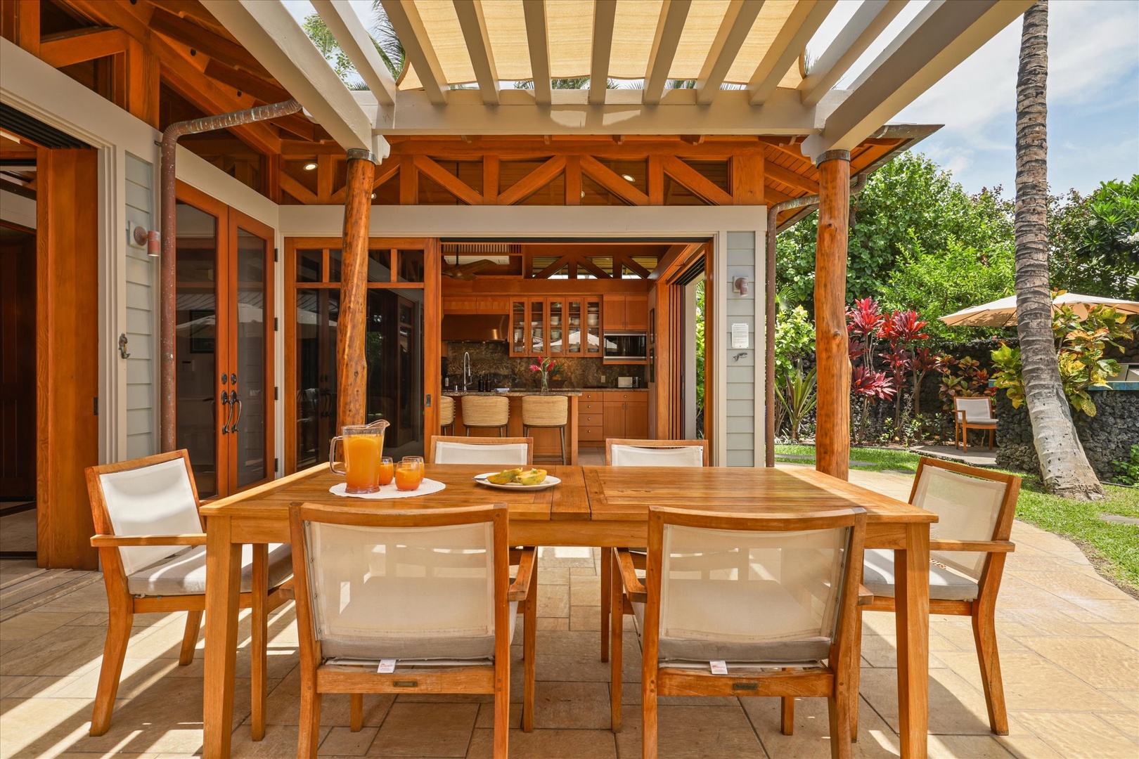 Kamuela Vacation Rentals, 3BD Na Hale 3 at Pauoa Beach Club at Mauna Lani Resort - Breakfast moves outdoors under the pergola.