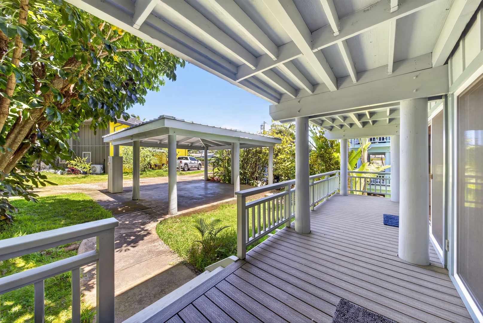 Haleiwa Vacation Rentals, Sunset Beach Hideaway - Welcome home to the covered lanai surrounded by tropical landscaping and trade winds.
