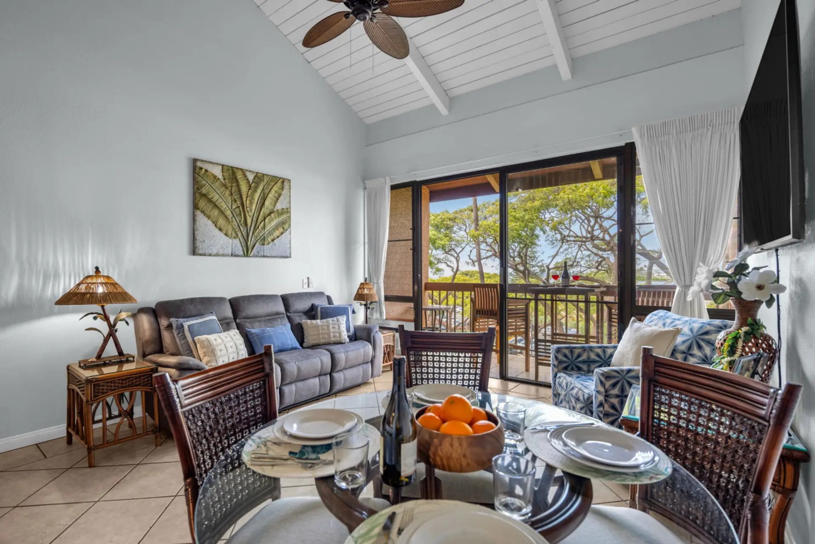 Kihei Vacation Rentals, Maui Vista 2420 - Set the glass table and let the treetops out the lanai doors do the rest.