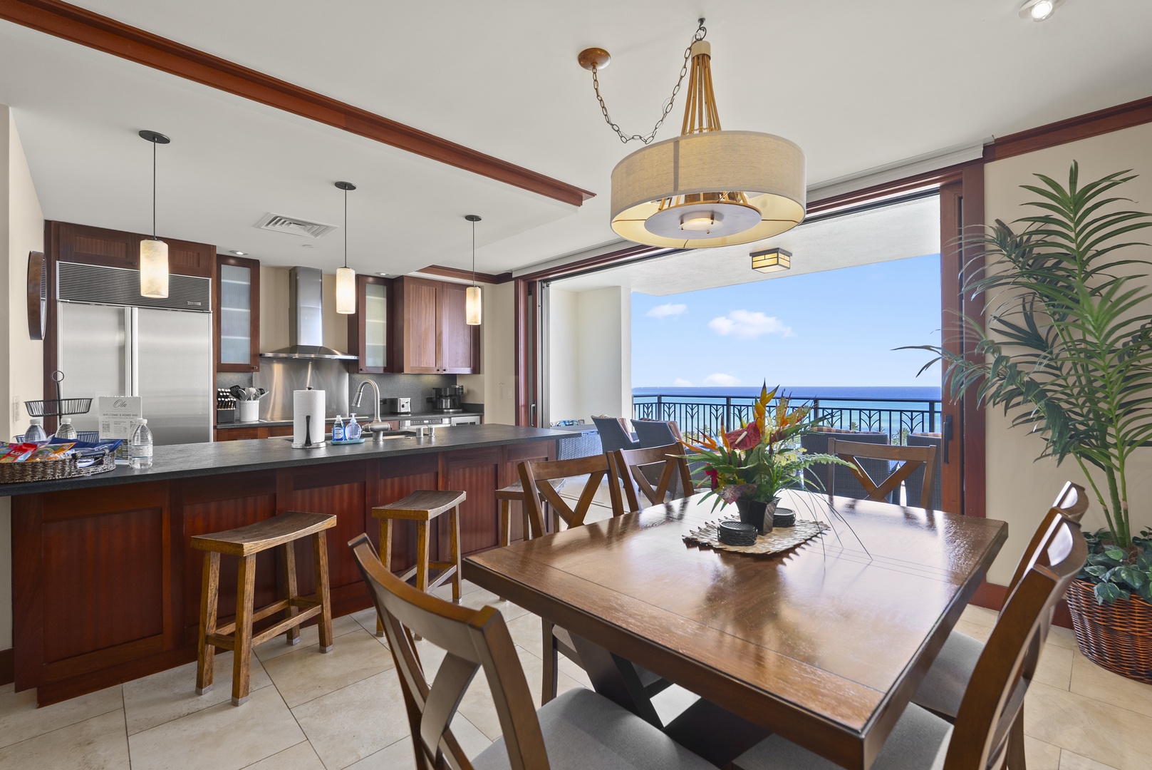 Kapolei Vacation Rentals, Ko Olina Beach Villas O1404 - Cook and dine in one open space, ocean light pouring through the far windows.