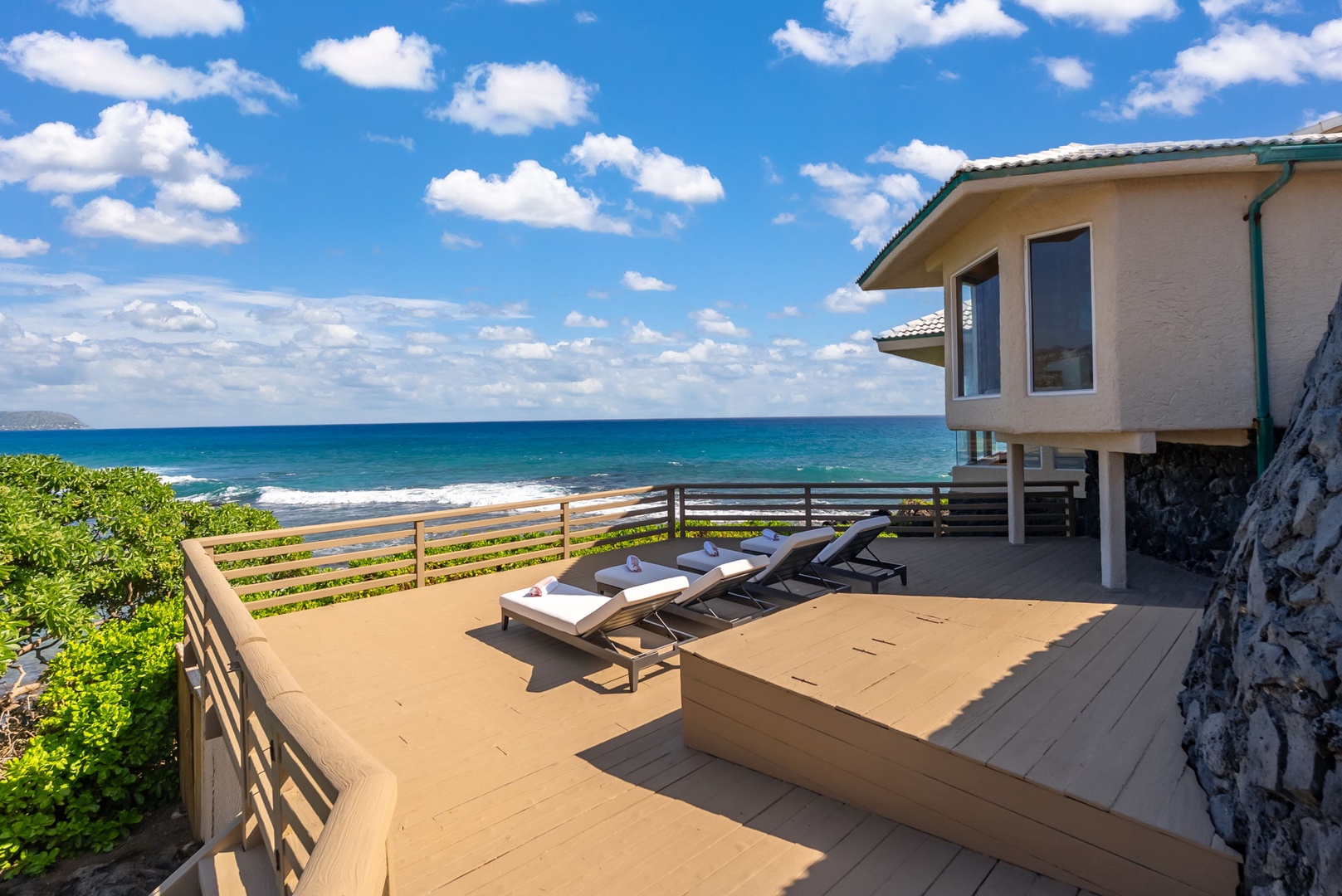 Honolulu Vacation Rentals, Black Point Ocean Villa - Spectacular beachfront lanai with loungers perfectly positioned for ocean views and relaxation in paradise.
