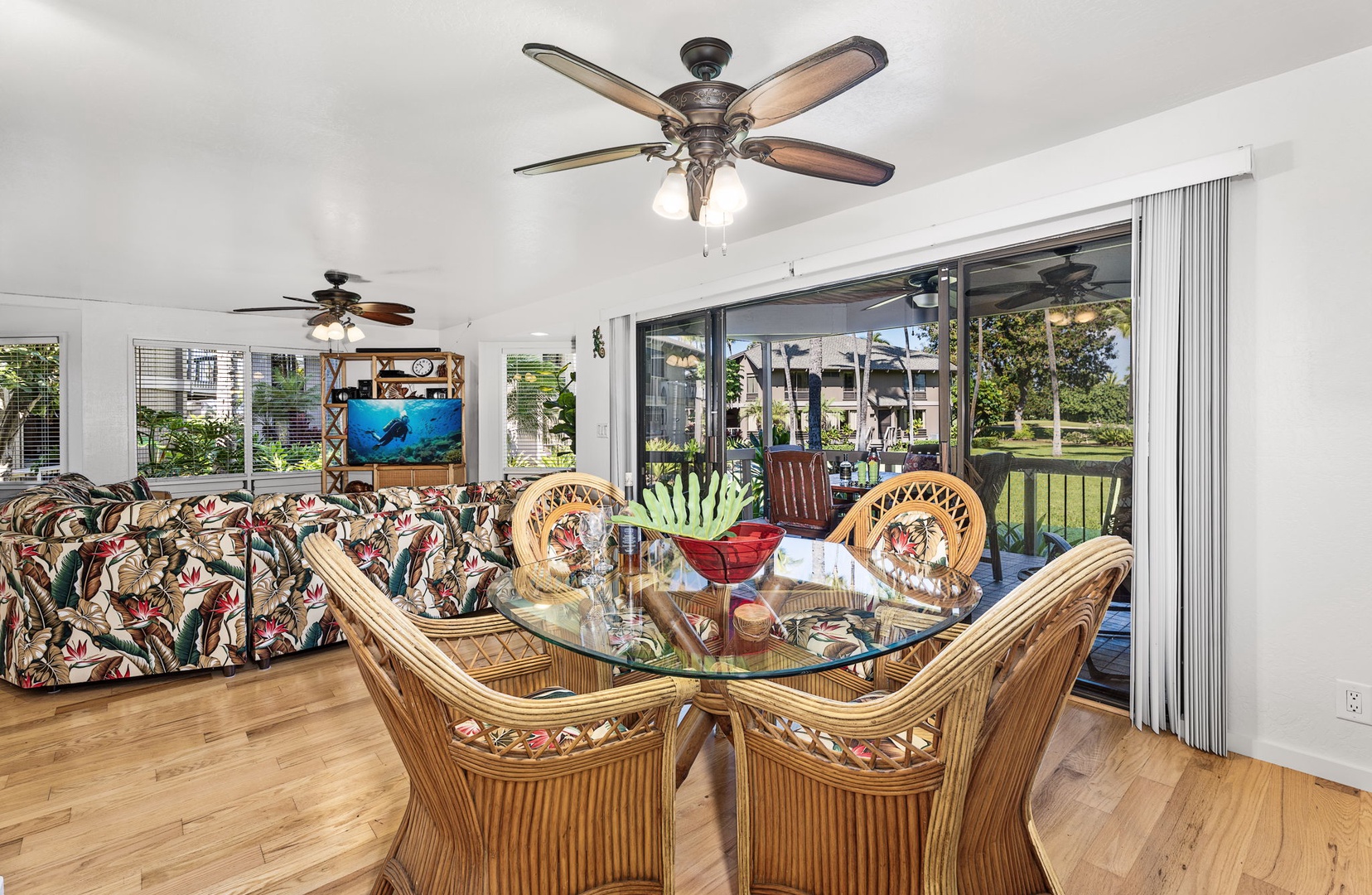 Kailua Kona Vacation Rentals, Kanaloa at Kona 701 - Gather in the tropical-inspired dining and living space where warm wood floors and rattan furnishings create your perfect island getaway.
