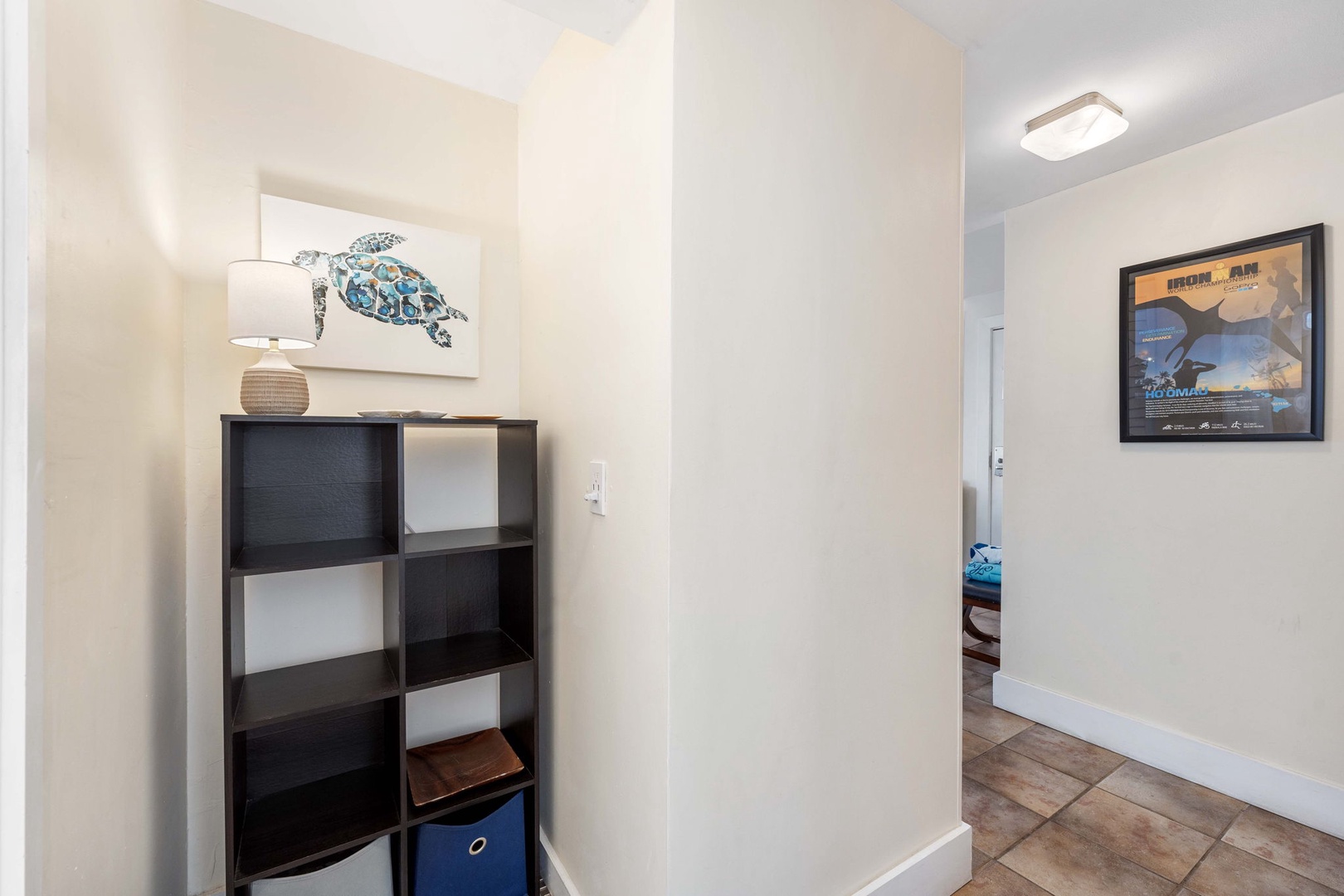 Kailua Kona Vacation Rentals, Kona Plaza 201 - Hallway space thoughtfully designed with convenient storage and coastal accents.