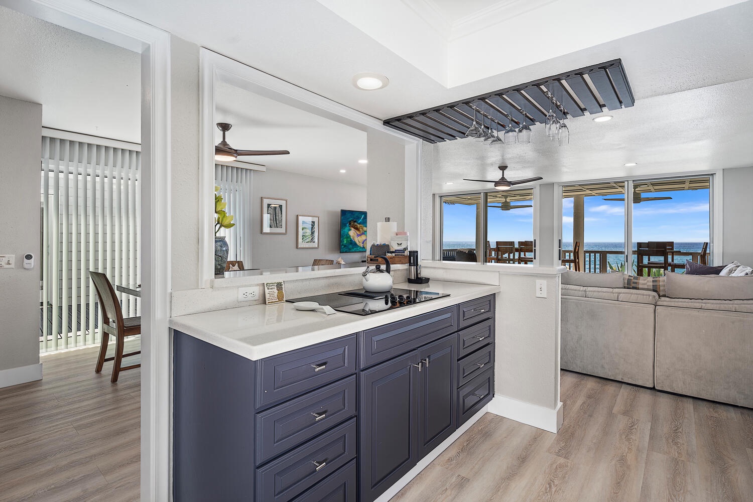 Kailua Kona Vacation Rentals, Hale Kai O'Kona #7 - High-end kitchen with stainless appliances, breakfast bar, and wine glass rack.