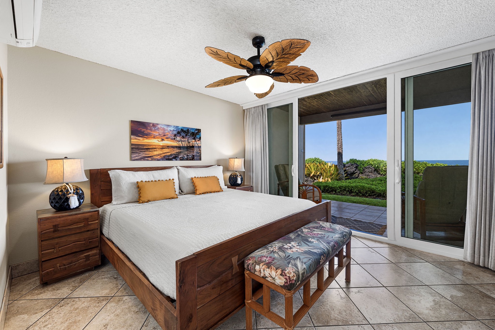 Kailua Kona Vacation Rentals, Keauhou Kona Surf & Racquet 1104 - The primary suite wakes up to a king bed angled toward the ocean view.