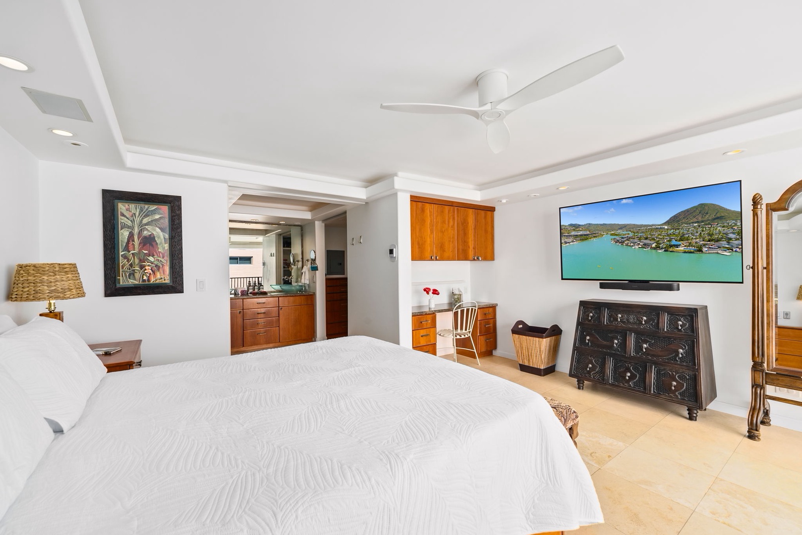 Honolulu Vacation Rentals, Kaimana Views - Spacious bedroom with natural light, cozy seating, and a peaceful ambiance—ideal for restful nights and relaxed mornings