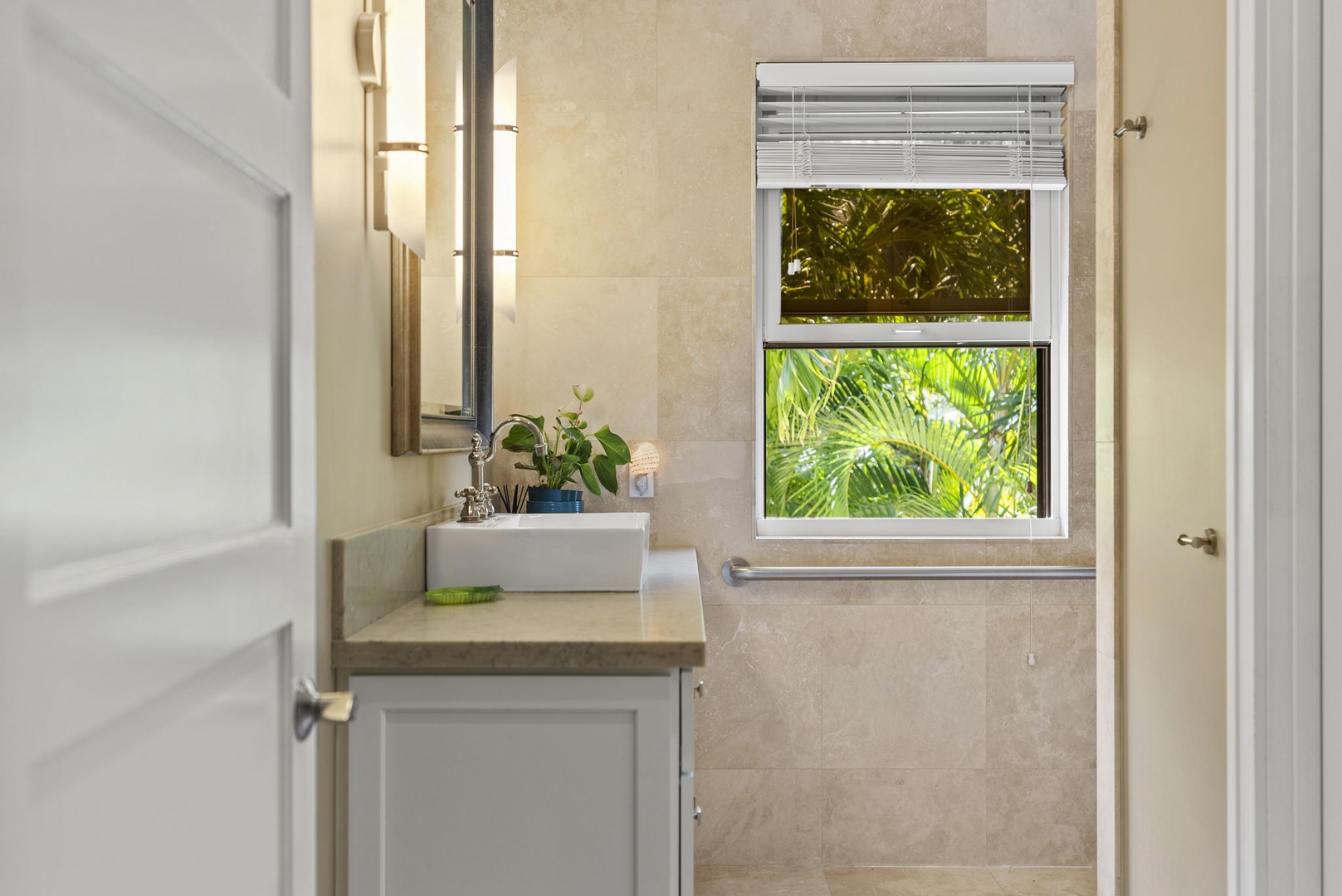 Honolulu Vacation Rentals, Pili Pono - Bathroom with contemporary sink and window view.