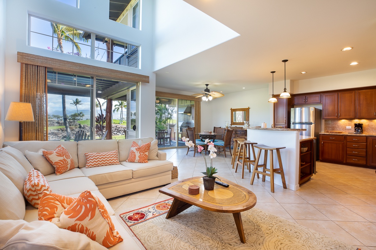 Kamuela Vacation Rentals, Mauna Lani Golf Villas C1 - Open-concept floor plan allows for flow between the well-equipped kitchen and the inviting living and dining spaces,