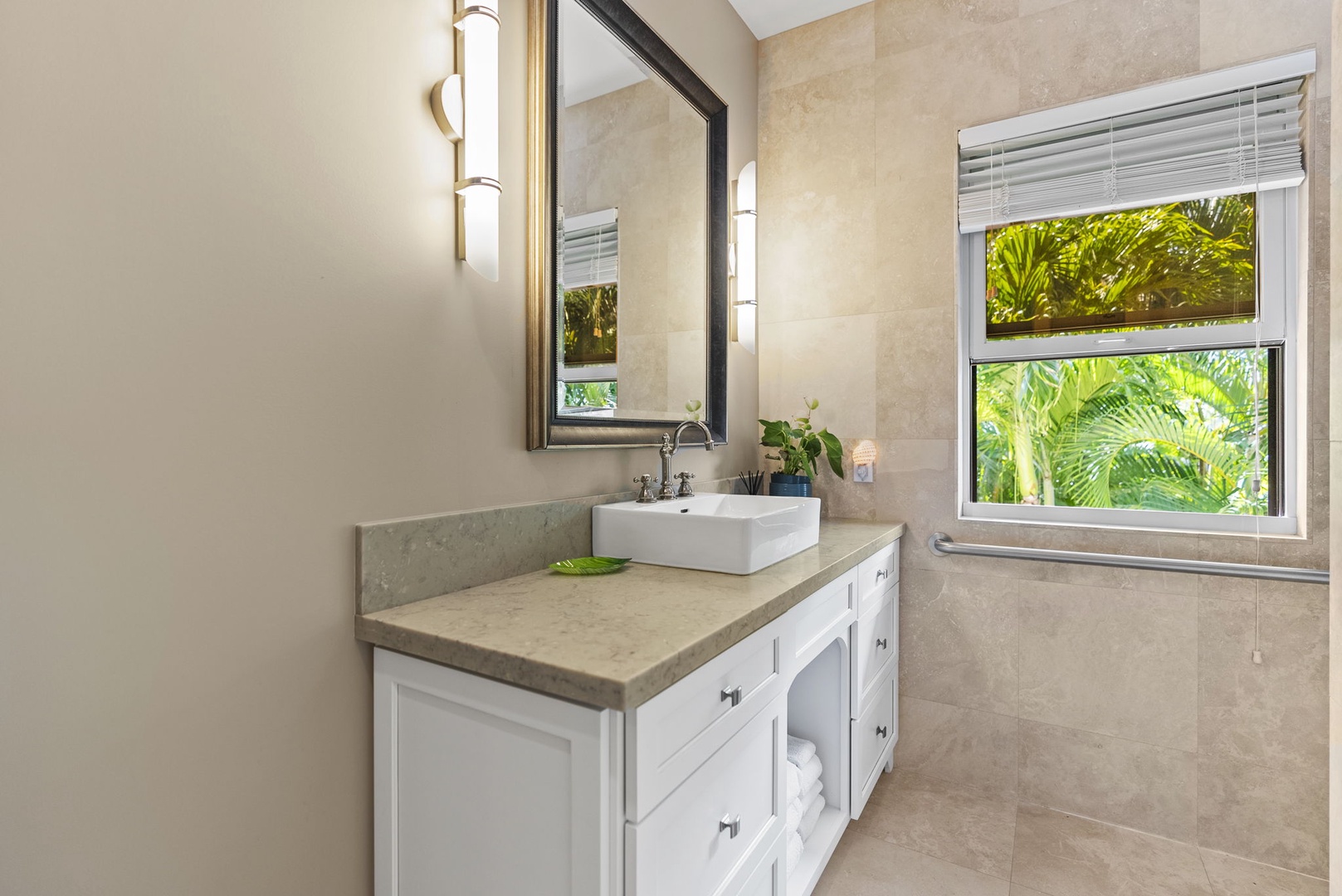 Honolulu Vacation Rentals, Pili Pono - Modern bathroom with sleek vanity and garden view.