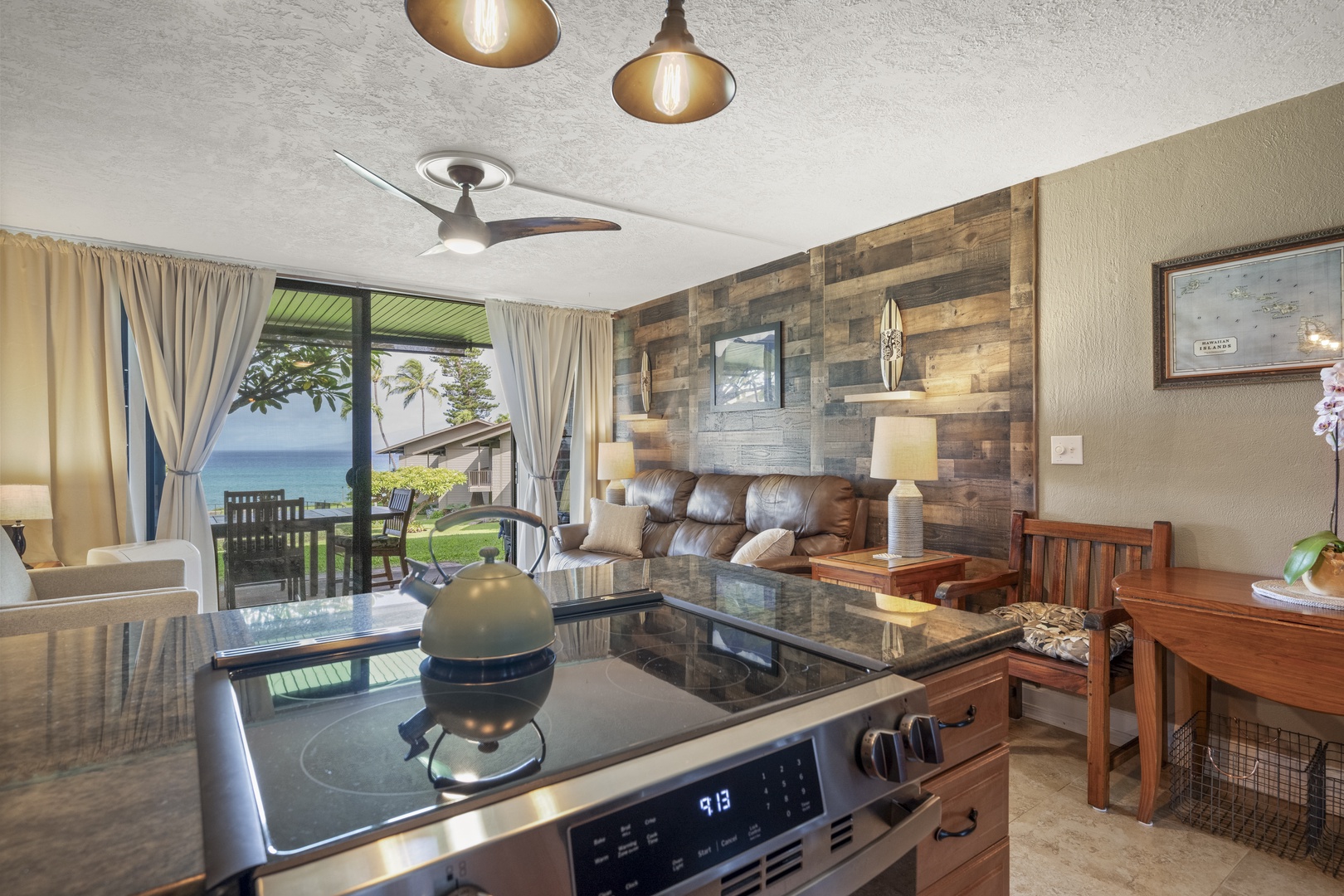 Lahaina Vacation Rentals, Polynesian Shores 114 - From the kitchen you can see clear through to the water past the sofa.