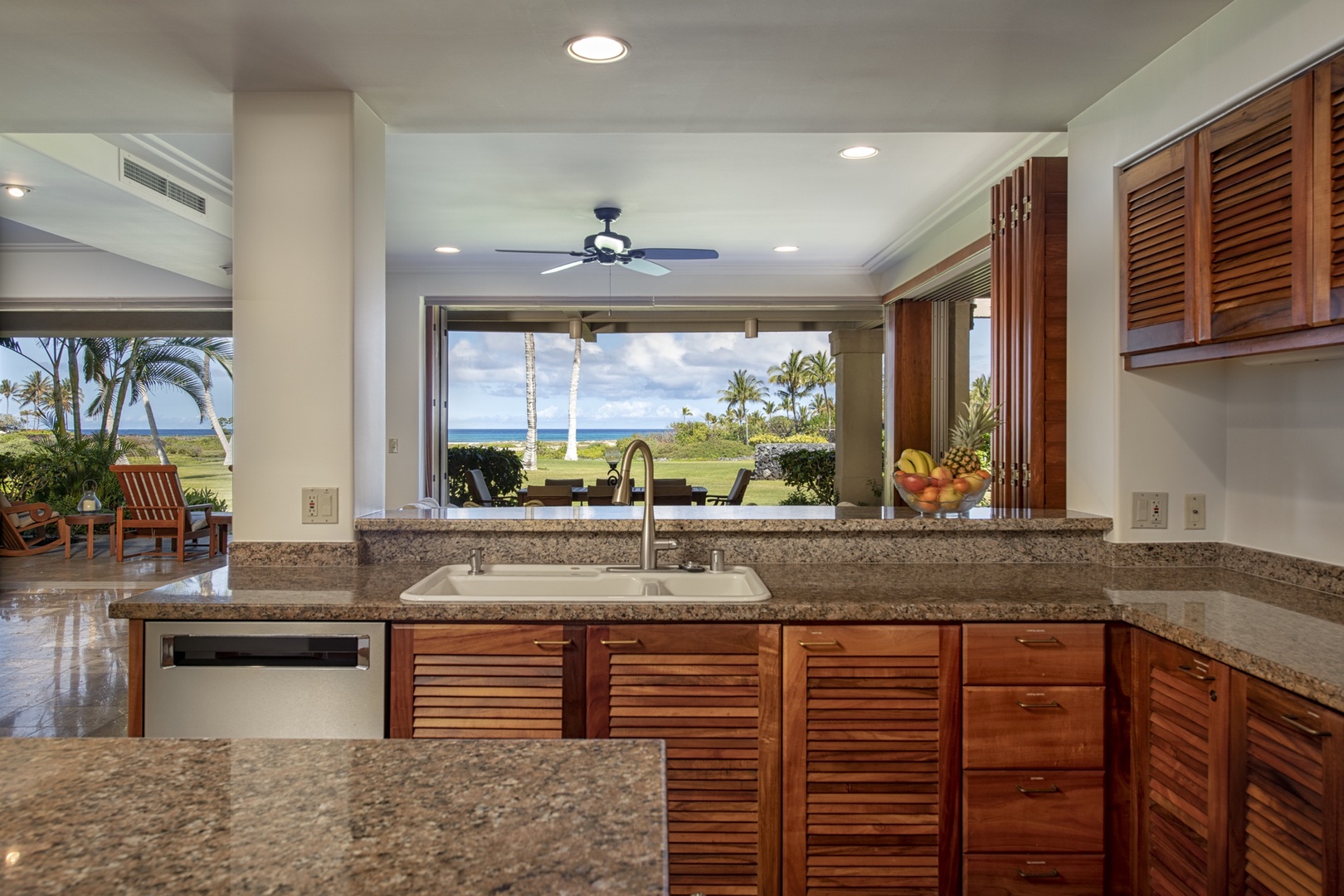 Kailua Kona Vacation Rentals, 3BD Golf Villa (3101) at Four Seasons Resort at Hualalai - Alternate view of the kitchen facing the lanai and ocean views.