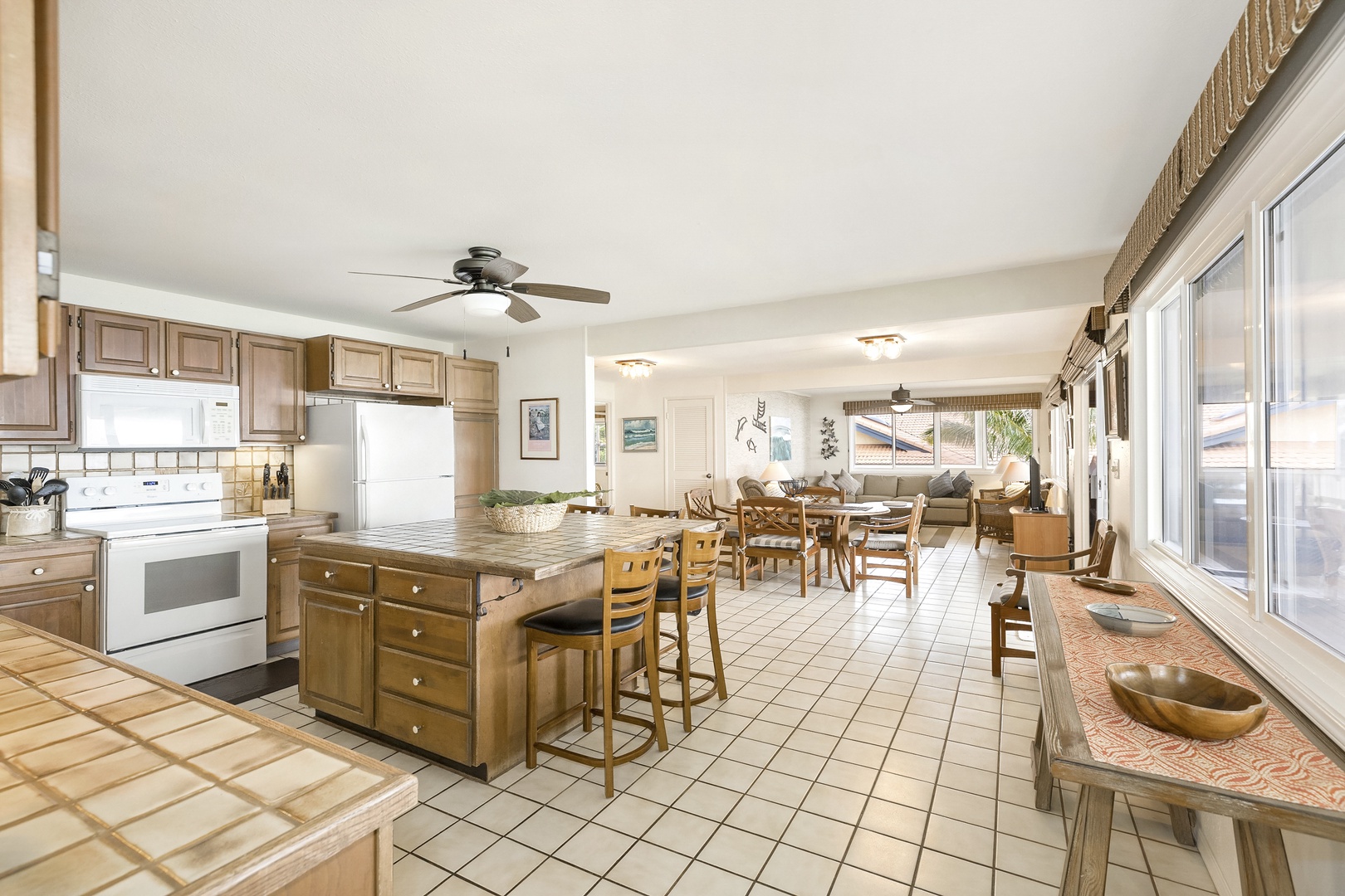 Haleiwa Vacation Rentals, Hale Kimo - Open floorplan in the upper-level with kitchen, dining and living spaces.