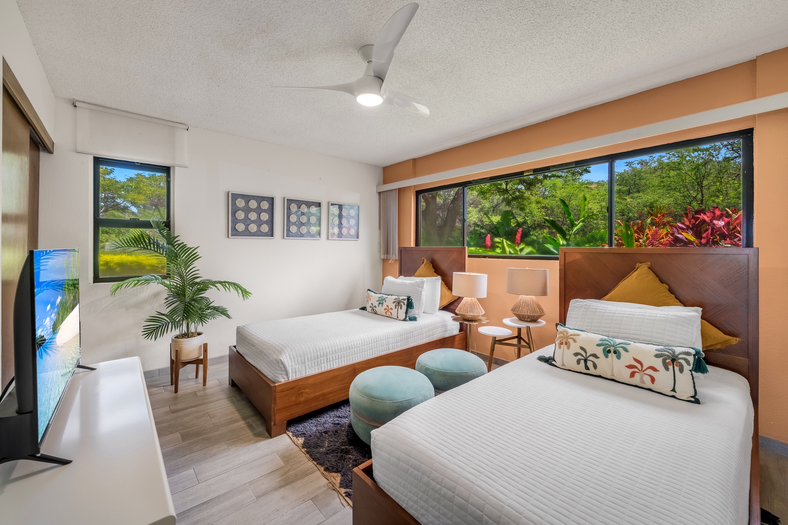 Waikoloa Vacation Rentals, Waikoloa Villas A107 - Unwind in this bright guest room with two beds and large windows that bring in natural light and garden views.