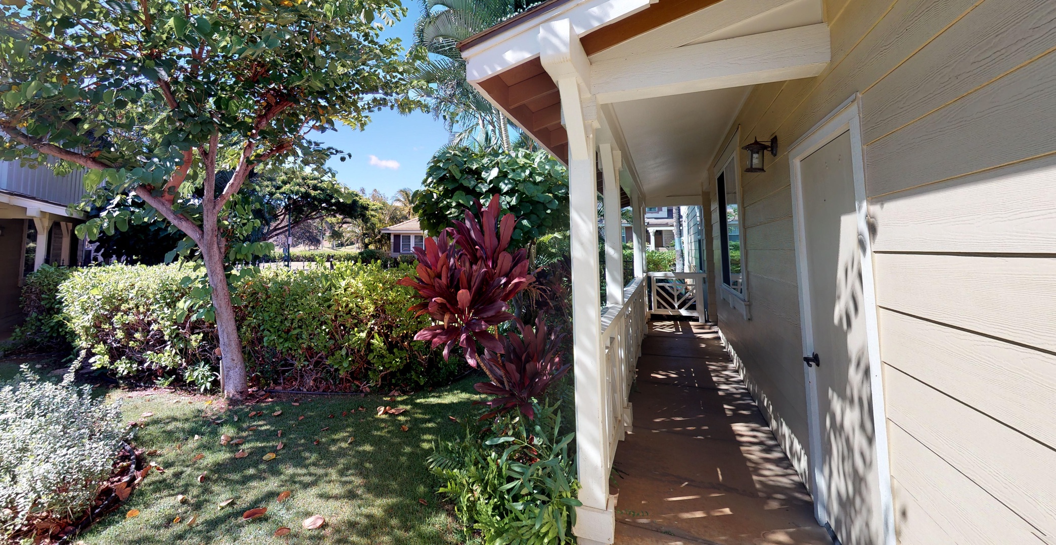 Kapolei Vacation Rentals, Ko Olina Kai 1051A - The sun dappled trees surrounding the entrance to the home.