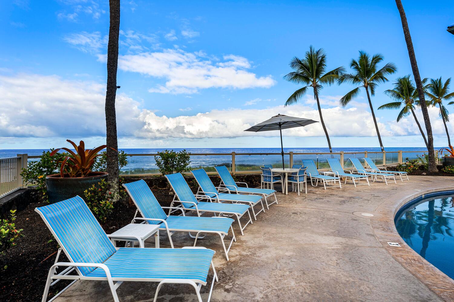 Kailua Kona Vacation Rentals, Kona Reef F11 - Lounge on the chaise loungers poolside with a cool drink.