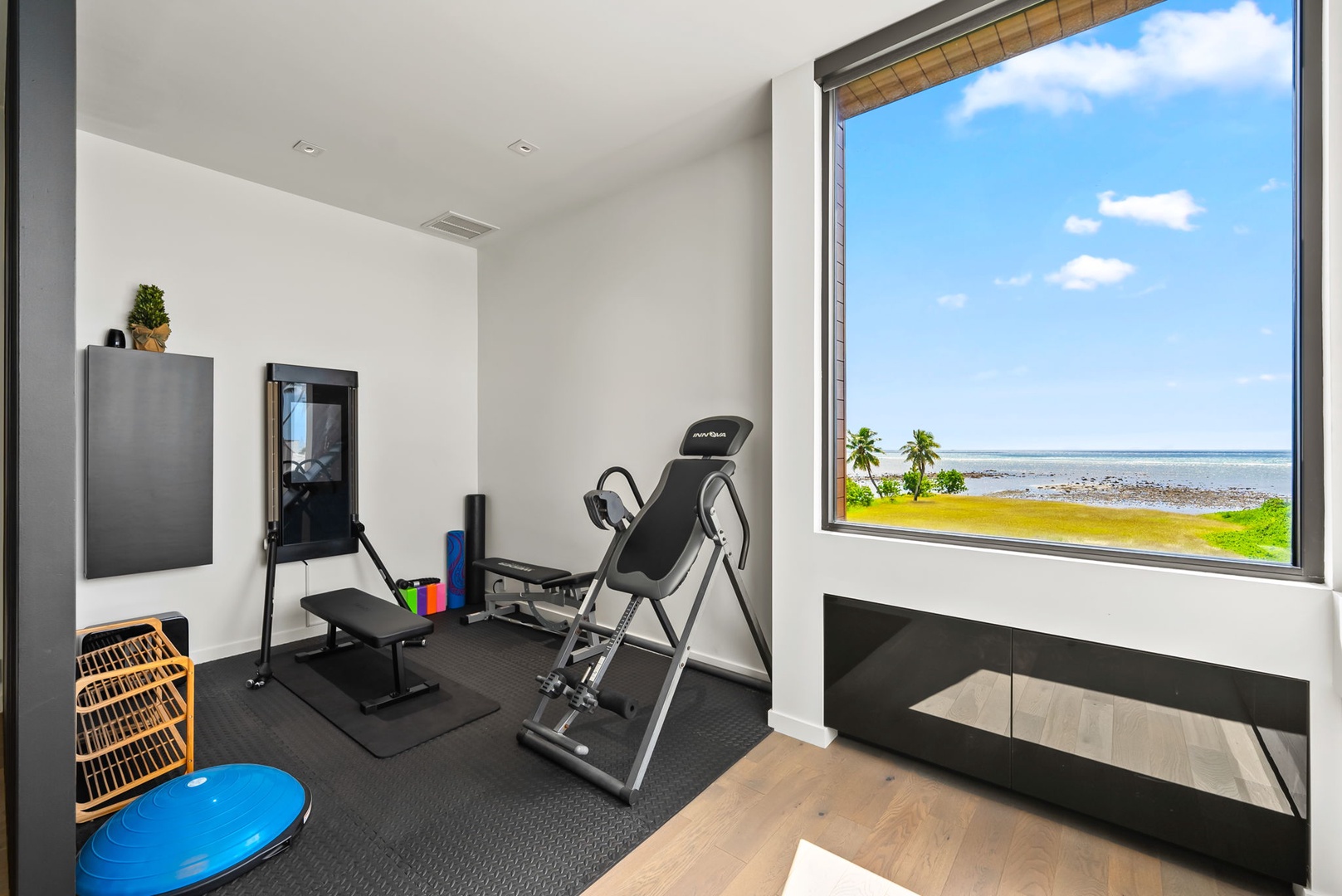 Honolulu Vacation Rentals, Ocean Villa Emilie - Private in-home gym with panoramic views ensures you never miss a workout—even on island time.