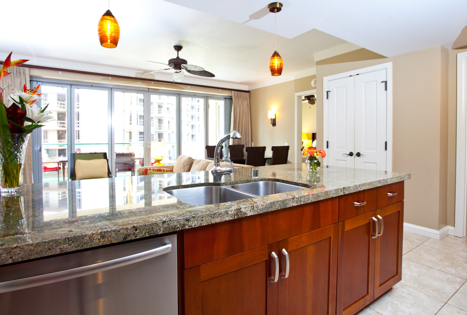 Lahaina Vacation Rentals, Honua Kai Hokulani 214 - The open-concept kitchen effortlessly blends into the living area, featuring sleek granite countertops and modern appliances for a touch of everyday luxury.