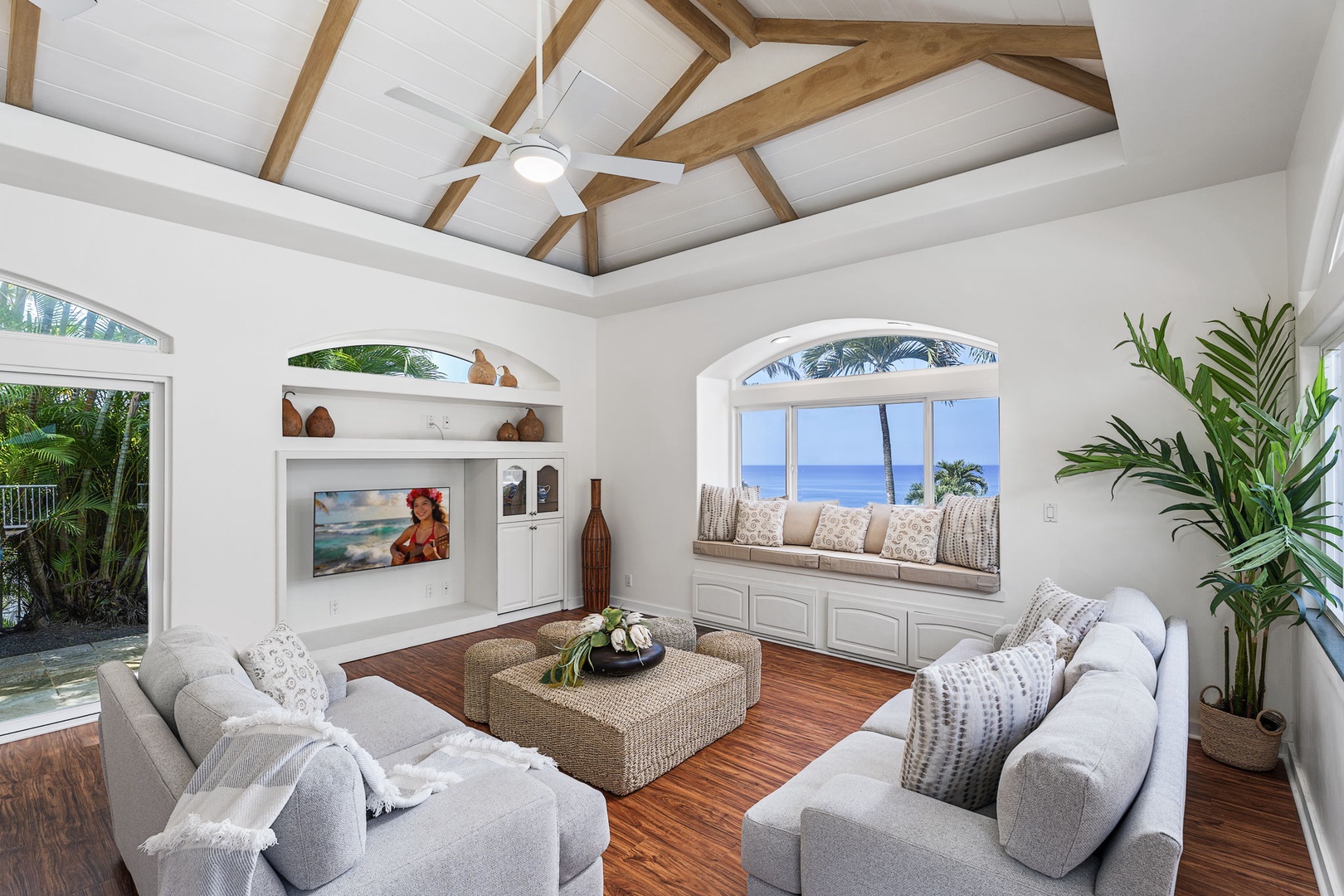Kailua-Kona Vacation Rentals, Honu Hale - Elegant living room with stunning ocean views and cozy seating perfect for relaxing evenings.