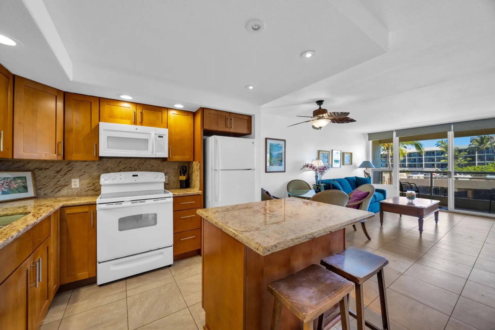 Kihei Vacation Rentals, Maui Banyan H306 - Pull up a stool at the granite island where breakfast happens before anyone commits to a plan.