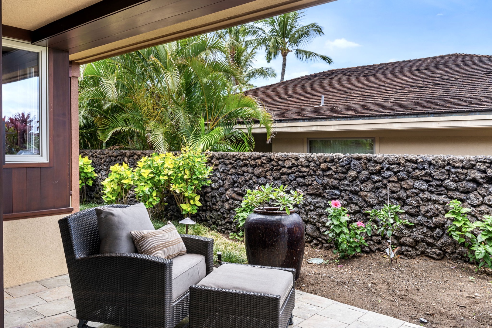 Kailua Kona Vacation Rentals, 3BD Pakui Street Estate (149) at Hualalai Resort - Tucked off to the side, a lanai corner for the conversation that outlasts dinner.