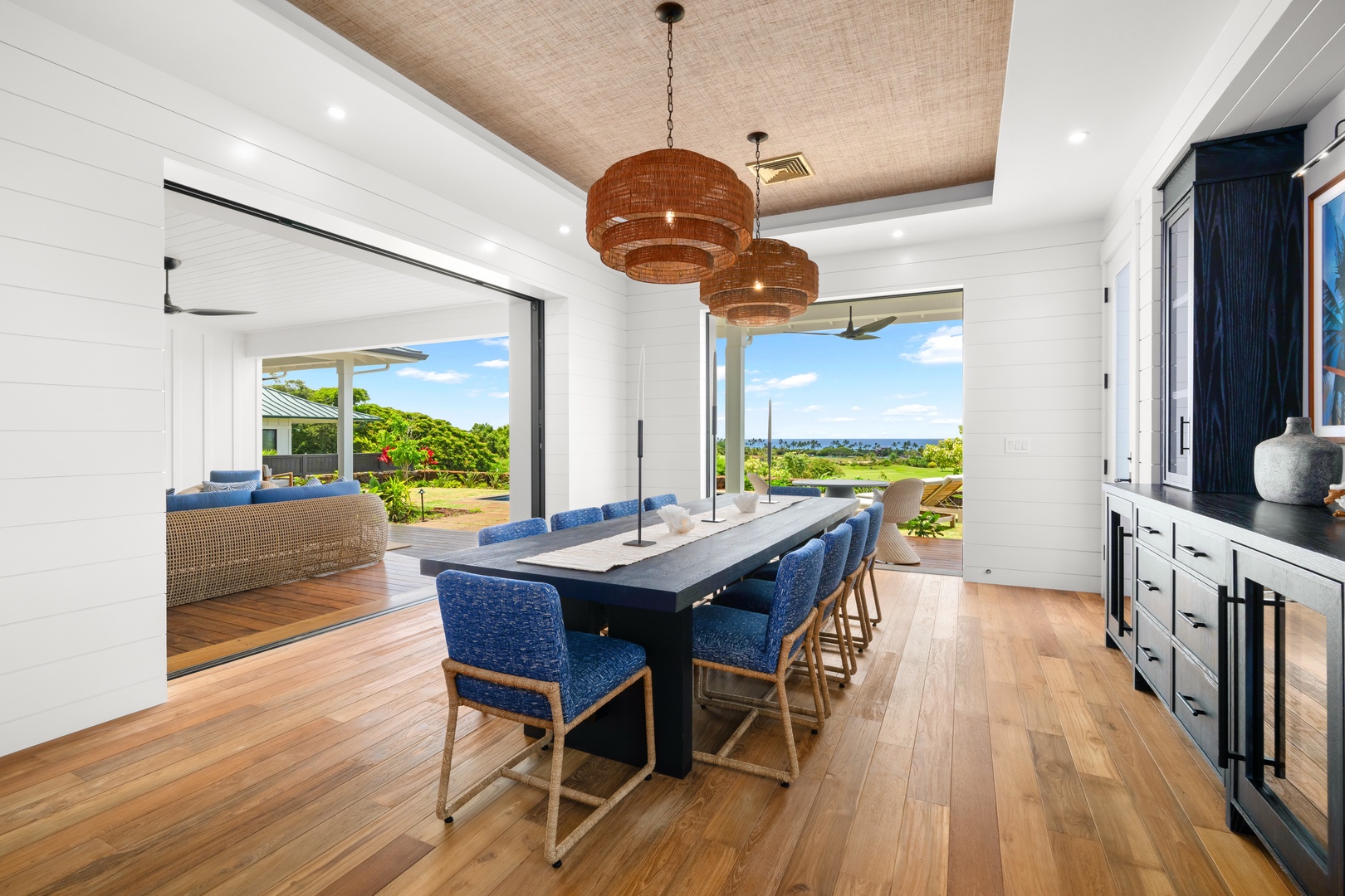 Koloa Vacation Rentals, Makani Kai - Woven pendants hang over a dining table set for the whole group.