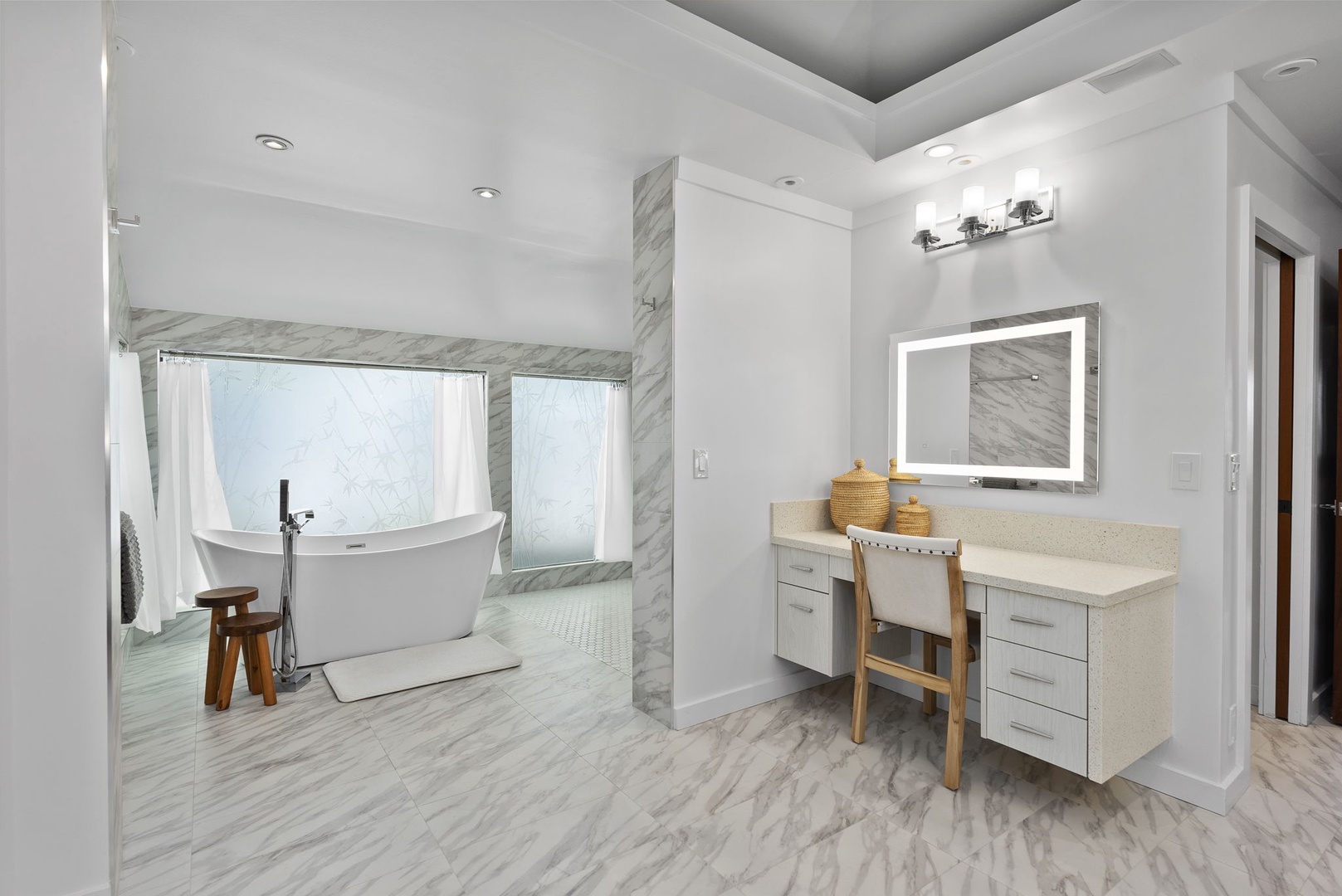 Honolulu Vacation Rentals, Honolulu Lagoonfront Villa - The spa-style ensuite bath in the primary suite includes dual vanities and a soaking tub set in marble elegance.