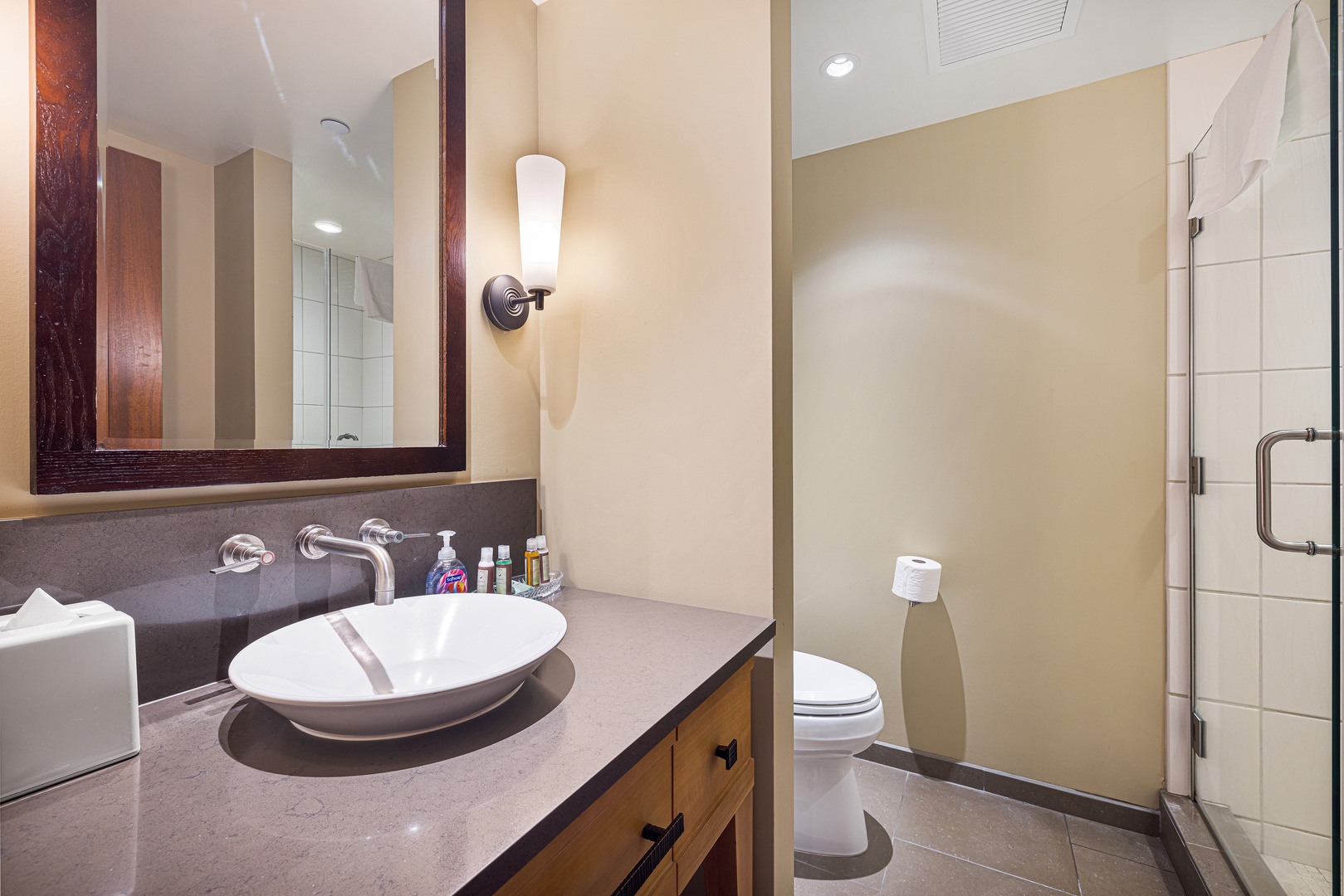 Step into your sleek, modern bathroom featuring an elegant oval sink, spacious countertop, and stylish finishes—perfect for freshening up before your next mountain adventure.