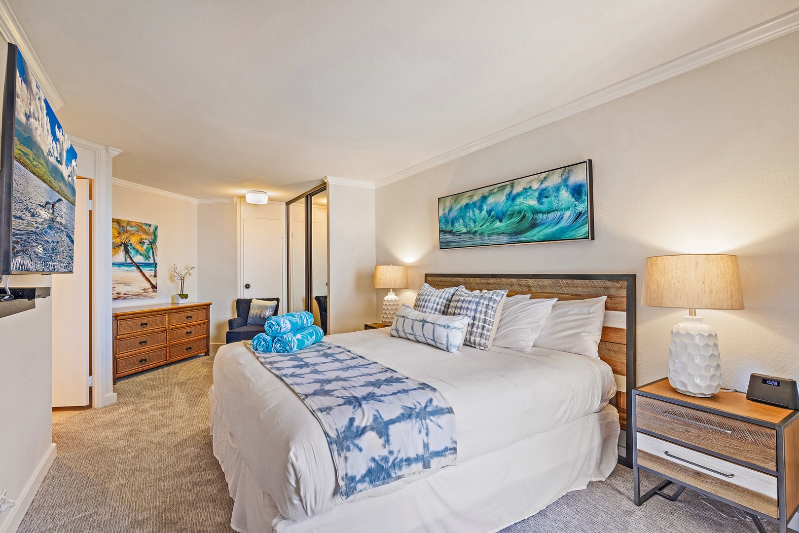 Lahaina Vacation Rentals, Kaanapali Shores 903 - The Primary Bedroom Suite offers a cozy king bed, vibrant décor, and a relaxing atmosphere, with easy access to the ensuite bathroom.