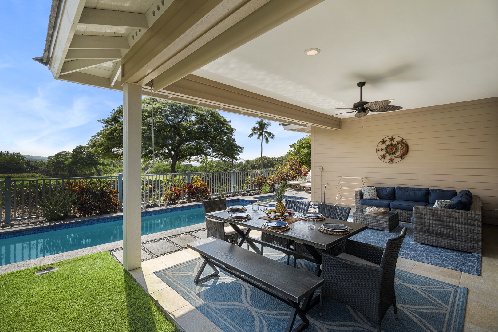Kailua Kona Vacation Rentals, Kona Blue Vacations Holua Kai - Relax in the shaded lanai at Kona Blue Vacations Holua Kai, steps from the pool and perfect for tropical lounging.