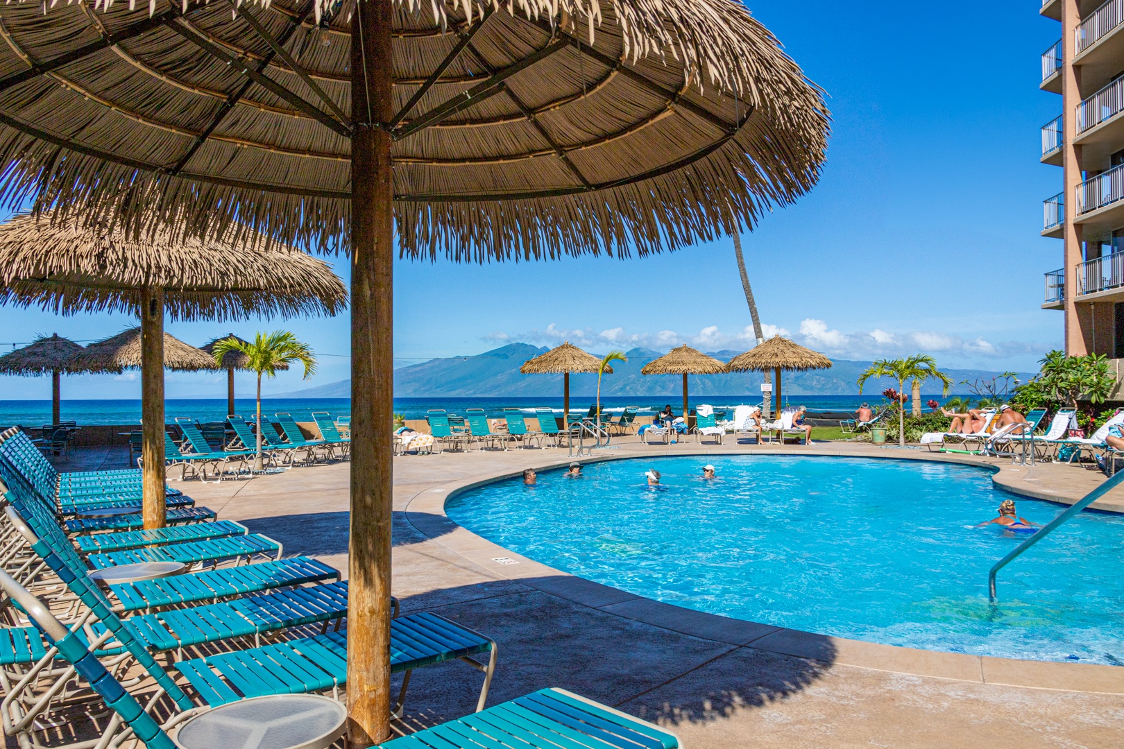 Lahaina Vacation Rentals, Royal Kahana 213 - The resort pool area offers stunning ocean views and plenty of lounge chairs, perfect for soaking up the sun and enjoying a refreshing swim.