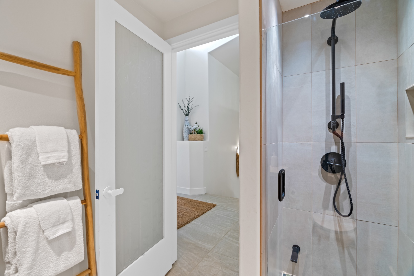 Princeville Vacation Rentals, Mana Wahine - Bright, modern bathroom with sleek walk-in shower and stylish details.