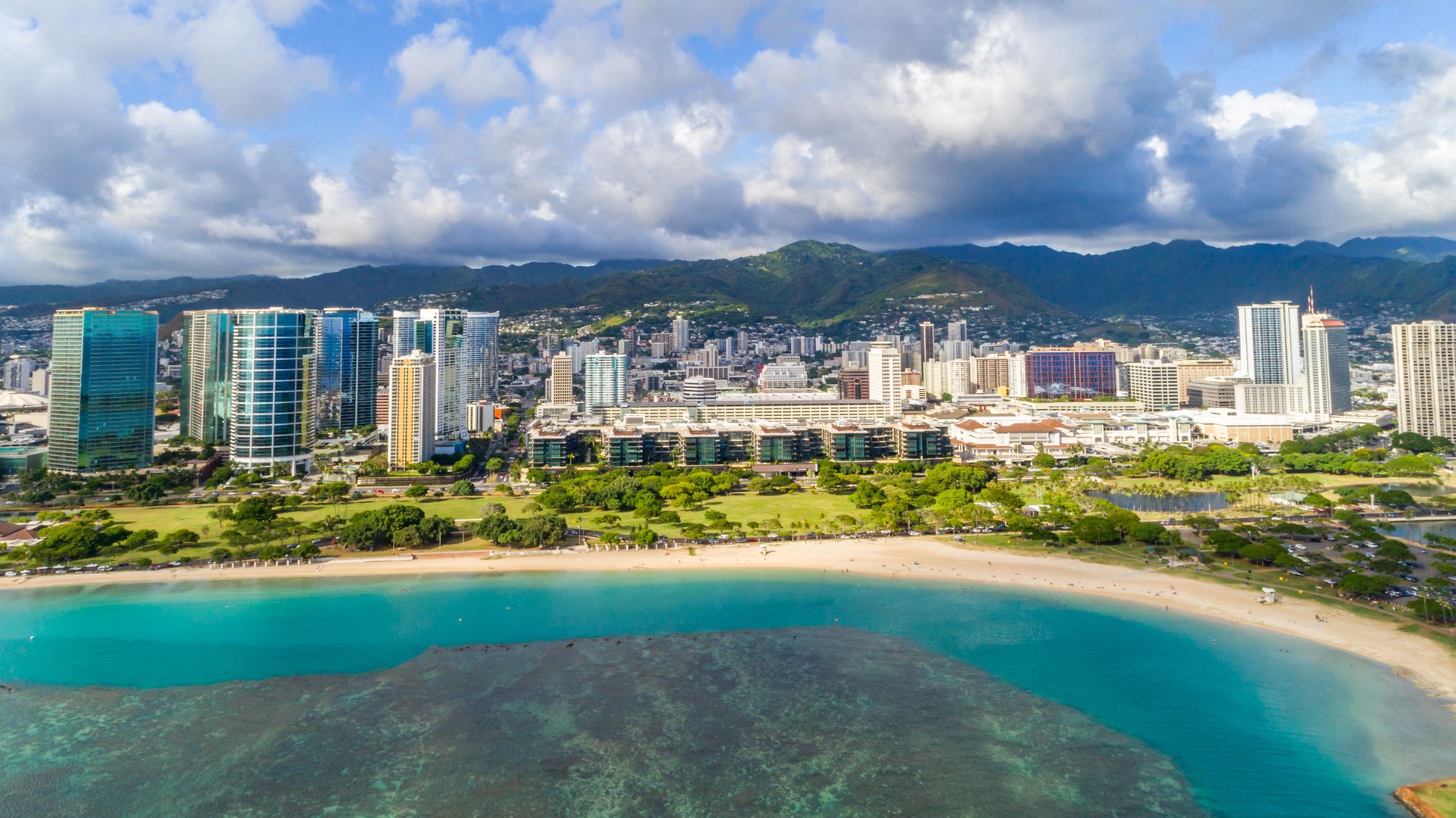 Honolulu Vacation Rentals, Park Lane Getaway - Aerial view of Honolulu’s skyline and turquoise waters – city meets beach paradise.