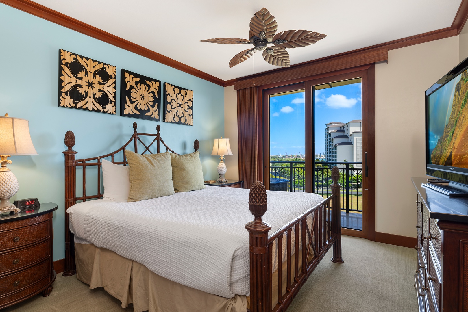 Kapolei Vacation Rentals, Ko Olina Beach Villas O724 - The primary guest bedroom with access to the lanai.
