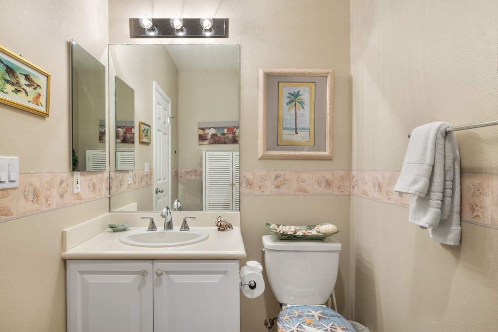 Kapolei Vacation Rentals, Coconut Plantation 1086-1 - The half bath guest bathroom.