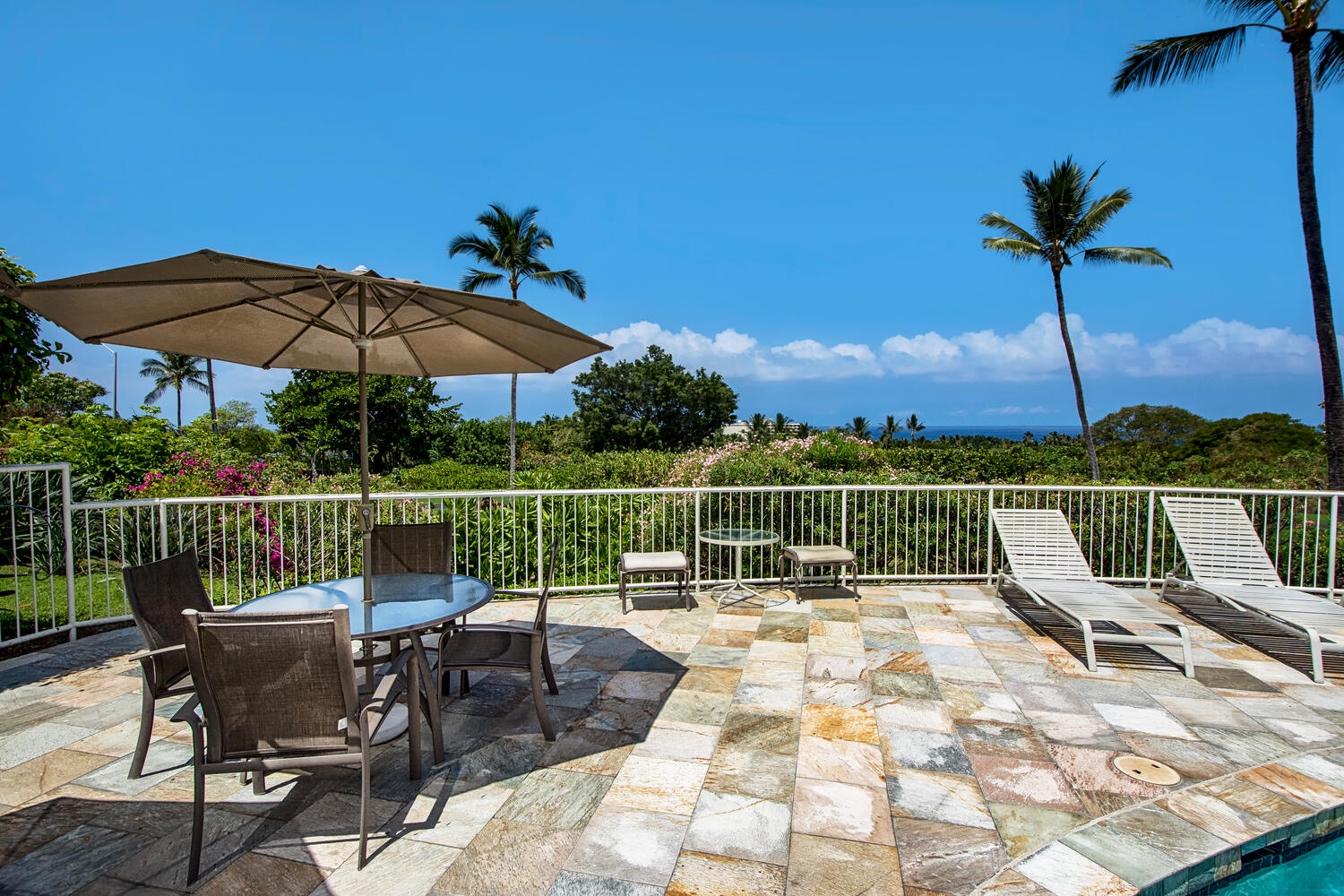 Kailua Kona Vacation Rentals, Keauhou Akahi 302 - The Pool Area has tables and chairs and ocean view.