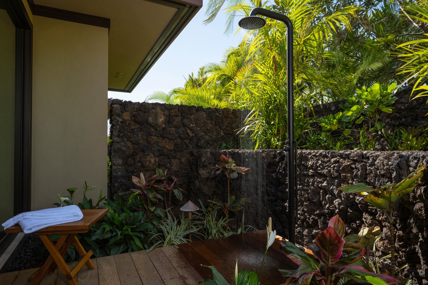 Kailua-Kona Vacation Rentals, 4BD Ka'Ulu Estate (102A) at Hualalai Resort - Primary Suite #1: Step into your private outdoor shower oasis, where tropical palms and lush gardens create the perfect natural spa experience.