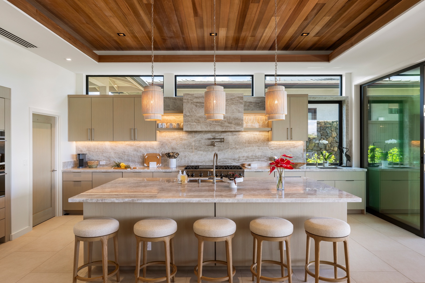 Kamuela Vacation Rentals, 6BD Mauna Lani Lux Golf Estate (5) at One Ocean - Settle in at the kitchen island for a relaxed spot to dine and gather.