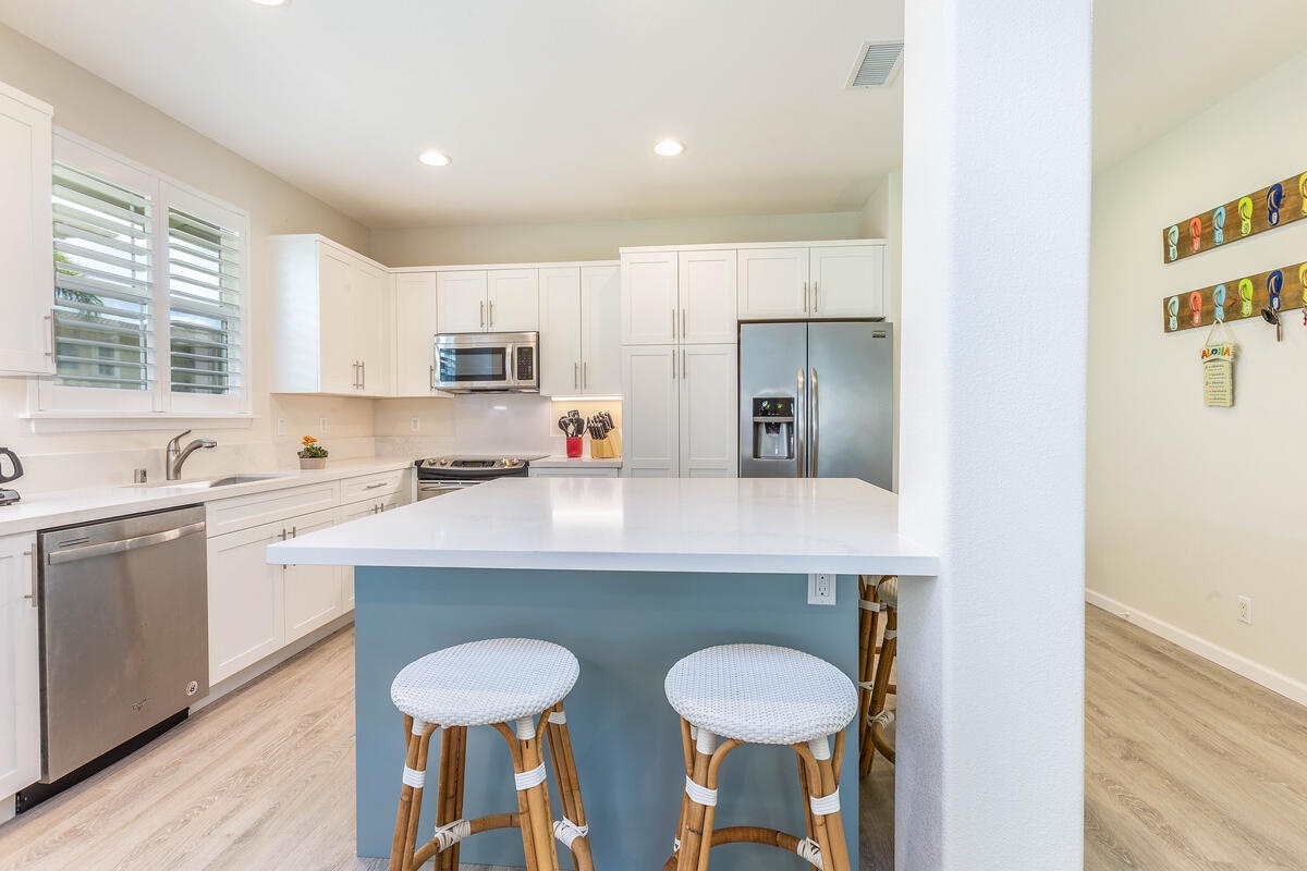 Princeville Vacation Rentals, Leilani Villa - Kitchen with breakfast bar seating