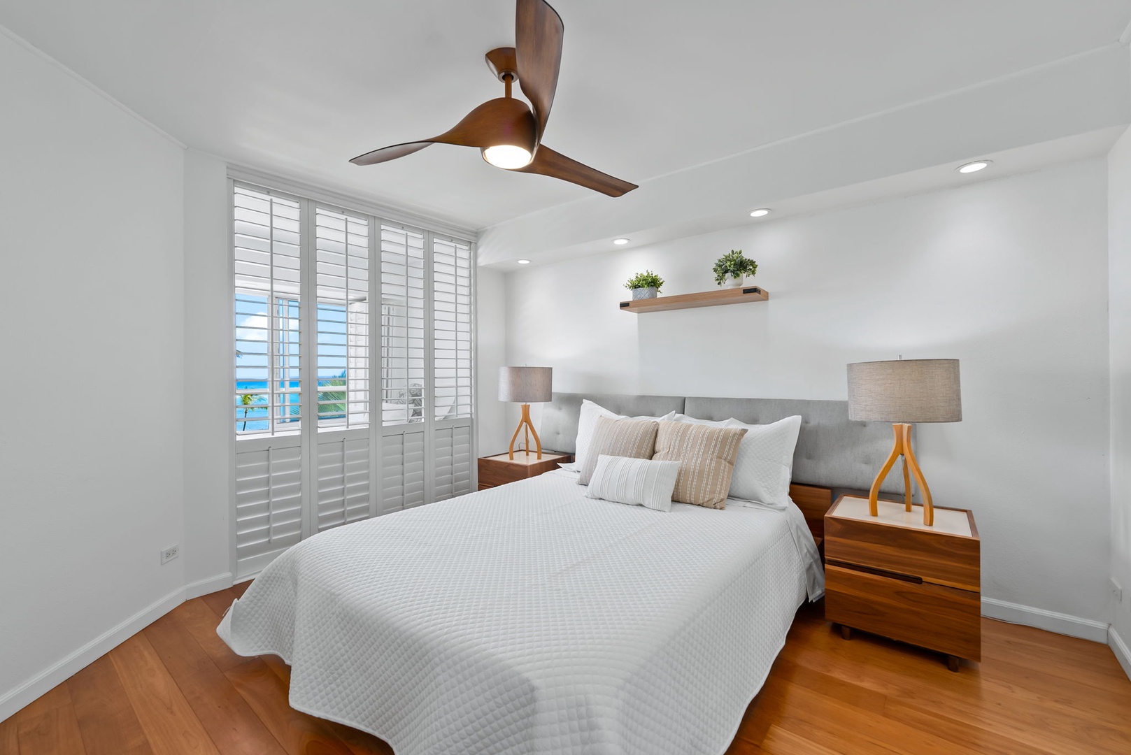 Honolulu Vacation Rentals, Colony Surf Retreat - The fully enclosed bedroom features a plush queen-size bed, soft linens, and plantation shutters for peaceful rest and privacy.