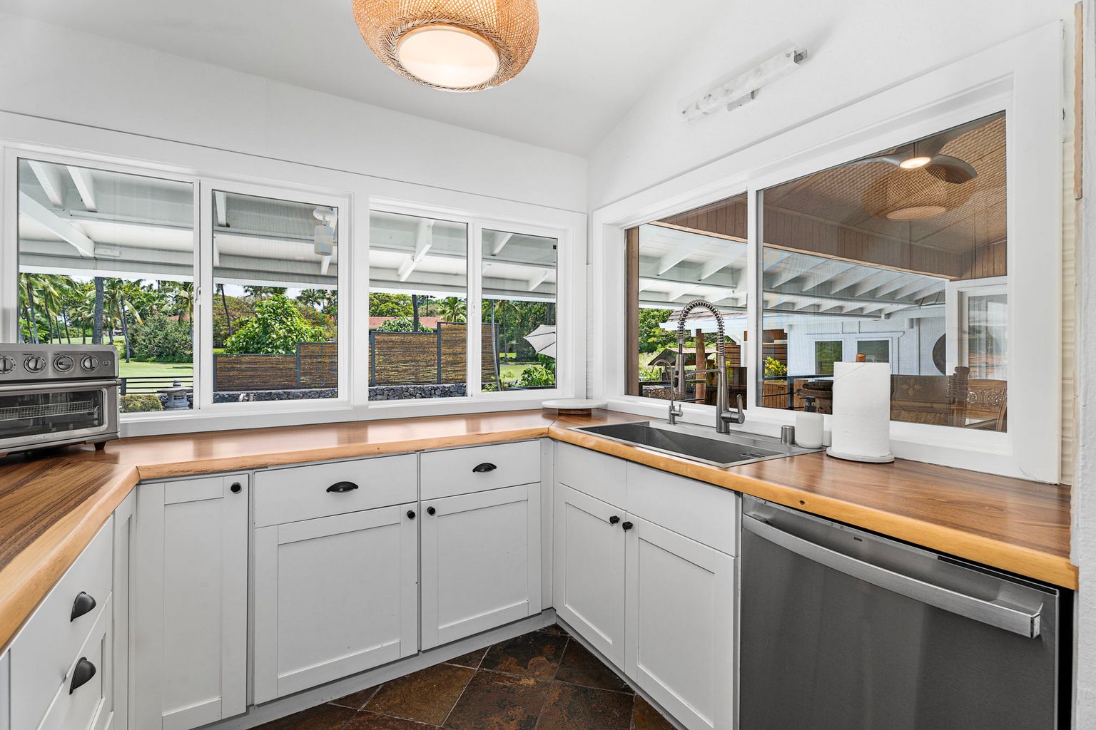 Kailua Kona Vacation Rentals, Manukai Hale - Windows wrap the kitchen, so the prep work happens in full daylight.