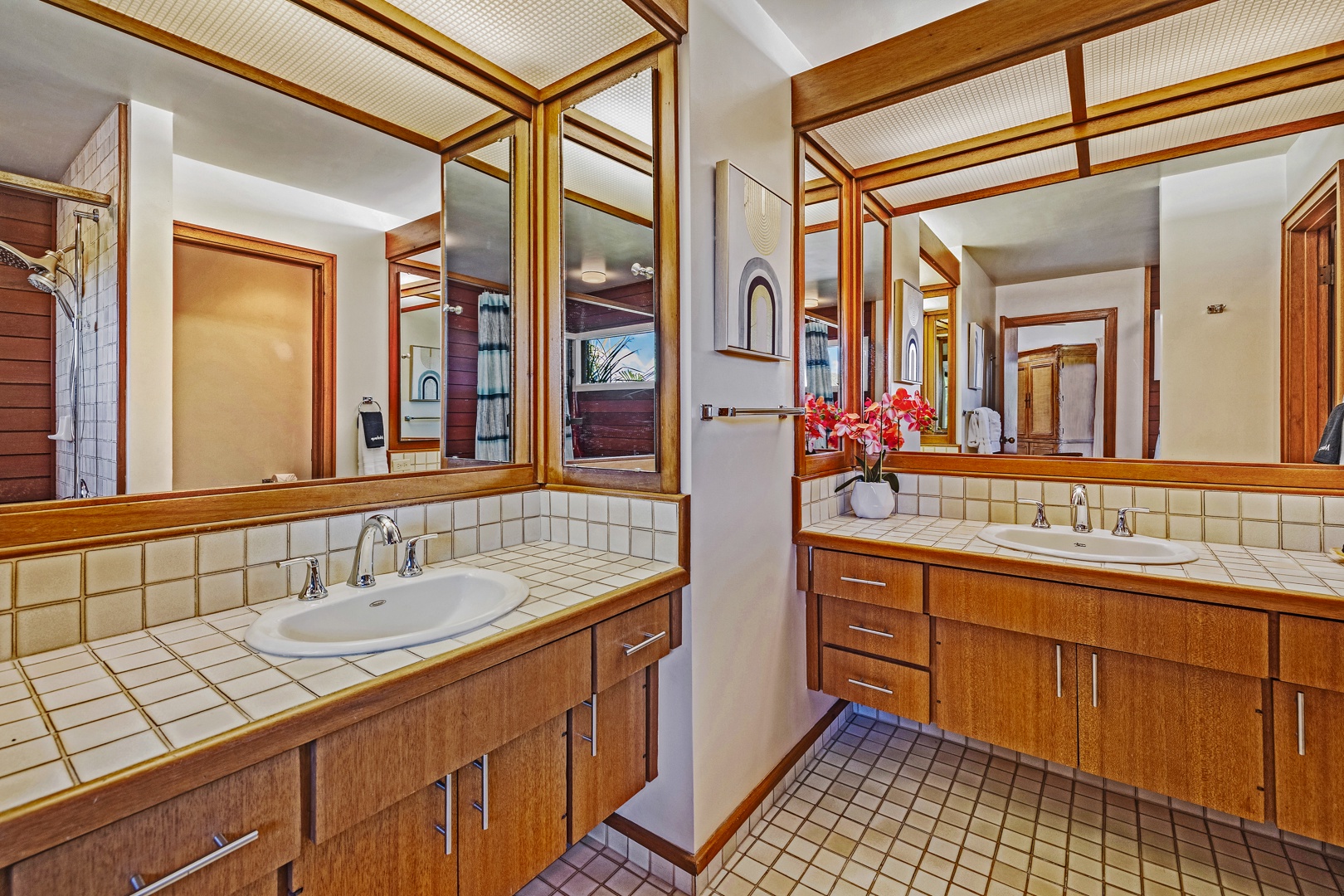 Lahaina Vacation Rentals, Kapalua Ridge 2321 - The double vanity at Kapalua Ridge 2321 features wood finishes and bright, even lighting.