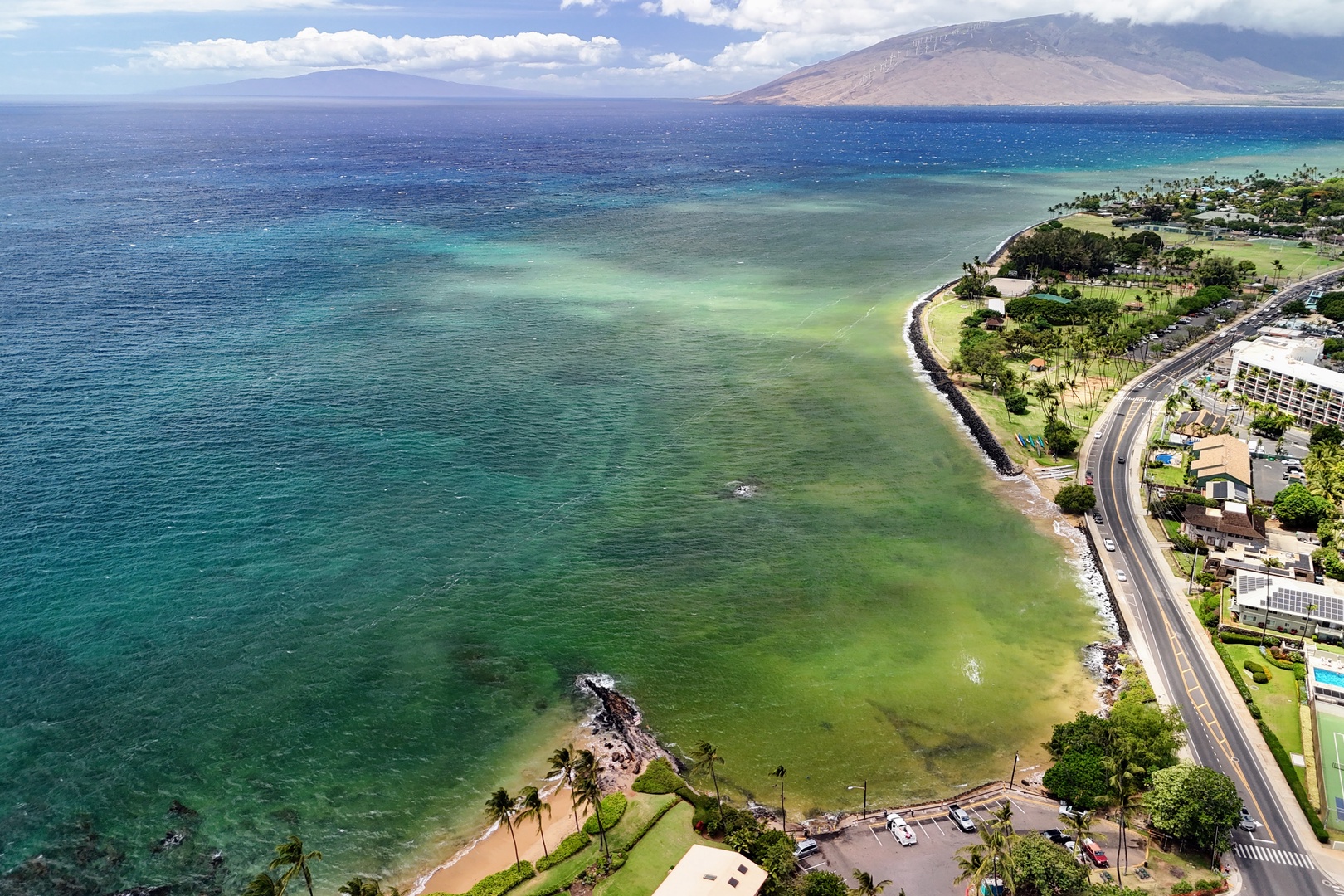 Kihei Vacation Rentals, Punahoa Beach 205 - The water shifts from turquoise to deep blue, with neighboring islands soft on the horizon.